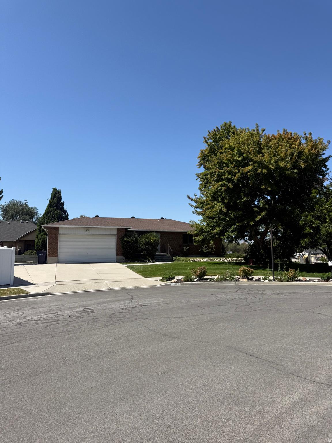 Partially Updated Rambler on an Oversized Lot - Prime Sandy Location  Welcome to 328 Heather Ridge Cir, Sandy, UT 84070- a classic brick rambler sitting on one of the largest, most usable lots in the neighborhood. Tucked at the end of a quiet cul-de-sac in the heart of Sandy, this home offers the rare combination of single-level living, a full walkout basement, and a backyard that truly has to be seen to be appreciated.  The home has been partially updated, giving you the best of both worlds - modern upgrades already in place, plus room to add your own personal touch and build equity. The kitchen has been beautifully refreshed with warm maple cabinetry, a large center island, stainless appliances, and updated countertops, while brand-new carpet has been installed throughout the upstairs bedrooms. Rich hardwood floors flow through the main living areas, and oversized windows frame stunning Wasatch mountain views. The rest of the home retains its original character, offering a fantastic opportunity for the next owner to update to their taste.  The main level offers comfortable bedrooms and a functional bath layout, while the fully finished walkout basement expands your living space with additional bedrooms, a second kitchen/dining area, and a large family room with French doors that open directly to the backyard - perfect for multi-generational living, a rental setup, or a private guest suite.  Outside is where this property really shines. The massive, fully fenced backyard is a rare find - expansive, level, and beautifully maintained, with plenty of room for kids, pets, gardens, RV parking, a future pool, or simply enjoying unobstructed mountain views. A generous elevated deck sits just off the kitchen, ideal for summer evenings, barbecues, and taking in the sunsets over the valley. Mature trees, tidy landscaping, and a spacious side yard round out one of the most versatile outdoor spaces on the market.  Additional highlights:  Updated kitchen and new upstairs carpet - move-in ready with room to add your own value  Attached 2-car garage with extra storage  Full walkout basement with second kitchen (ideal for extended family or rental potential)  Corner cul-de-sac lot - minimal traffic, extra privacy  Mountain views from the deck and upper windows  Canyons School District  Minutes to I-15, Fort Union Blvd, shopping, dining, and world-class skiing at Little and Big Cottonwood Canyons  Homes with this much yard, this much potential, and this location don't come along often. Come see it in person - you'll want to call it home.  Square footage figures are provided as a courtesy estimate only and were obtained from County Tax Data .  Buyer is advised to obtain an independent measurement.