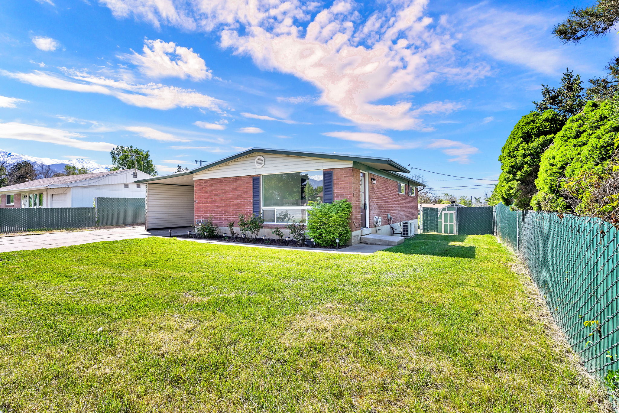 **Seller willing to contribute to a rate buydown. Possible lender buydown as well! Call for details** Classic brick charm with all the right updates. This beautifully remodeled 5-bedroom, 2-bath home features new carpet, paint, flooring, quartz countertops, all new appliances, both bathrooms completely redone, hand tiled, stylish lighting, LARGE family room, custom front door, so much storage! Outside a large, clean  shop with two roll up doors, approx. 7 feet tall, plus a storage shed. Fully fenced, easy to show