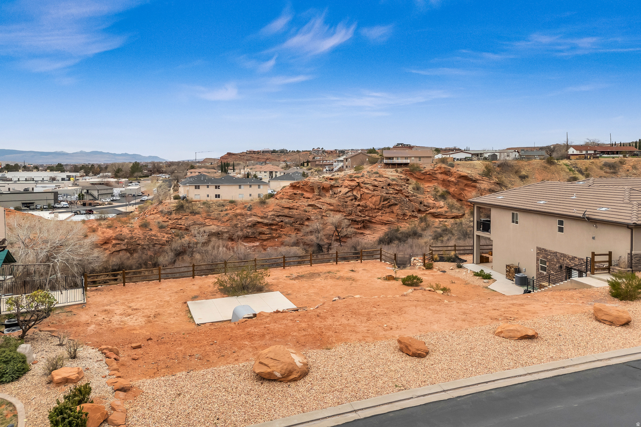 Nestled in the highly sought after Millcreek Springs Subdivision, this .16 acre vacant lot is ready for your dream home. This is one of the largest lots and the last view lot left in this subdivision that overlooks Mill Creek and the beautiful red rock cliffs of the canyon. With the added privacy of no backyard neighbors, on a street that terminates in a cul-de-sac, enjoy peace and privacy year round. The view of Mill Creek and the canyon are beautiful any time of day, but especially breathtaking at sunset when the red rock cliffs are lit up by the evening sunlight. Imagine the views from your future back deck and walk out basement. The rock retaining wall and log pole fence at the back of the property are an added bonus for both beauty and saved cost. The water connection fee has already been paid by the seller, and all other utilities are stubbed and available at the lot for a hassle-free construction process. There is no minimum home size requirement in this HOA. Other beautiful homes in this neighborhood with same or smaller lot size range from 2200-3200 sqft. The gentle slope of the lot is perfect to accommodate a walkout basement overlooking the beautiful red rock canyon. The HOA offers fantastic amenities, including two pools, hot tub, splash pad, park, walking/running paths, basketball court, and pickleball courts. This lot is the perfect blend of natural beauty, modern convenience, and close proximity to all southern Utah has to offer. Concrete pad and window well on the lot are superficial and were used as a play area/basketball court by sellers. Agent is related to the seller. Buyer and Buyer's Agent to verify all information.