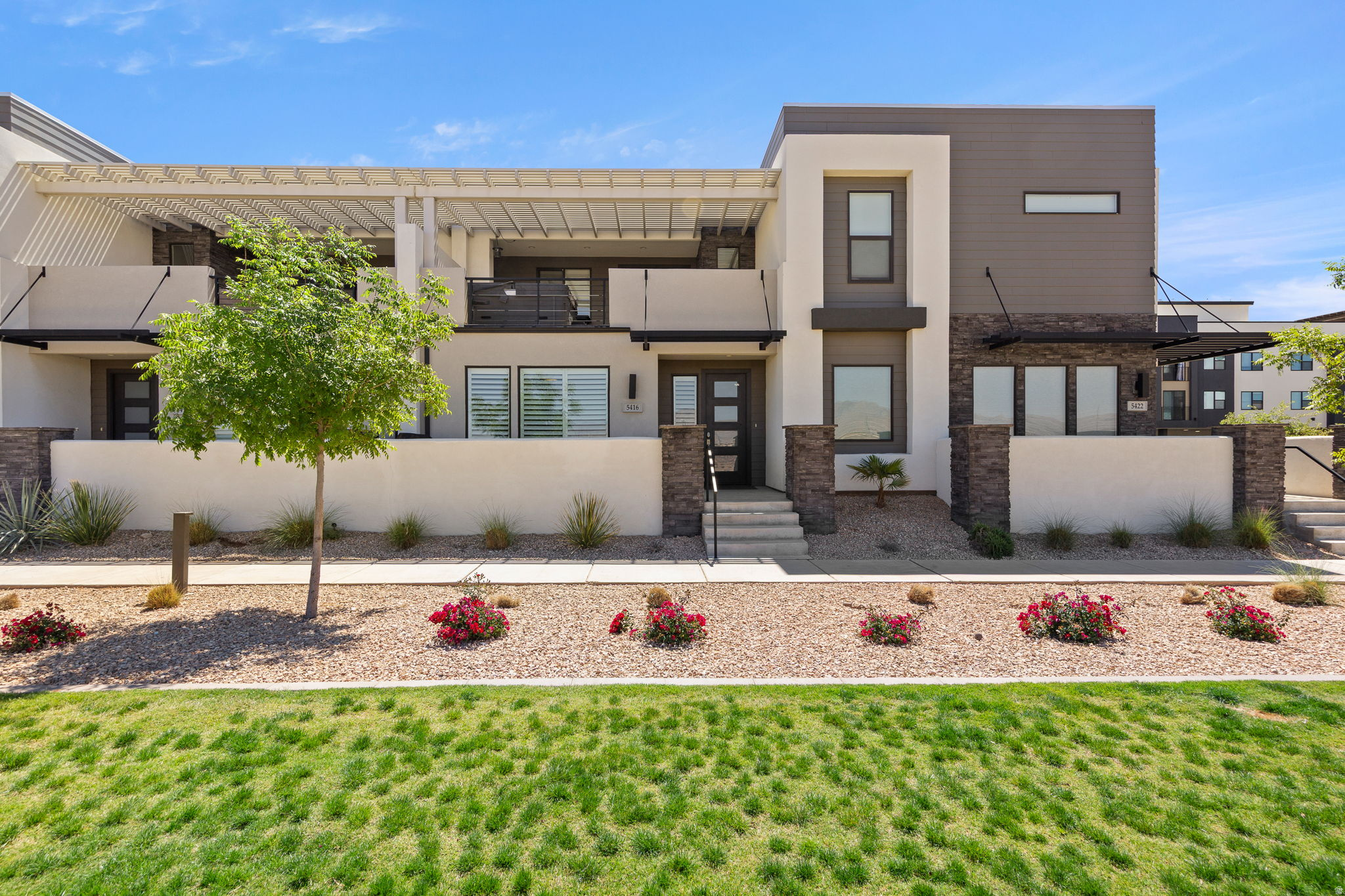 Experience resort-style living in the highly sought-after Desert Color community! This beautifully designed townhouse is approved for short-term rentals and offers the perfect blend of comfort, style, and investment potential. The light and bright interior features an open-concept layout with modern finishes and inviting living spaces throughout. Step outside to your private deck complete with a relaxing hot tub, perfect for unwinding after a day of adventure. Enjoy access to incredible community amenities including the stunning lagoon, pools, sandy beaches, pickleball courts, trails, and more. Whether you're looking for a vacation getaway, income-producing property, or both, this Desert Color retreat checks all the boxes.
