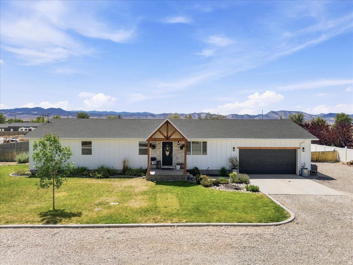 Built in 2004, this farmhouse-style rambler sits on a fully landscaped half-acre in Centerfield with a share of irrigation water and sprinklers on both culinary and secondary systems. Inside you'll find nearly 1,500 sq ft, 4 bedrooms, 2 bathrooms, hardwood floors, and quartz countertops throughout. The primary suite features a walk-in closet and a jetted tub. Additional updates include a water softener, new dishwasher, and new water heater. The exterior has been freshly updated with new siding, new paint, and stone accents on the front, plus a recent re-roof. The garage includes a bonus man cave along with a storage room, ideal for food storage and extra items without worry of freezing. Outside, enjoy a fully fenced yard with a shed, garden boxes, an orchard, and a patio perfect for warm evenings. The chicken coop stays with the sale... and if you'd like the hens too, they're perfect layers and can stay right along with it. A well-loved home, ready for its next owner... come see it for yourself.    Square footage figures are provided as a courtesy estimate only and were obtained from county .  Buyer is advised to obtain an independent measurement.