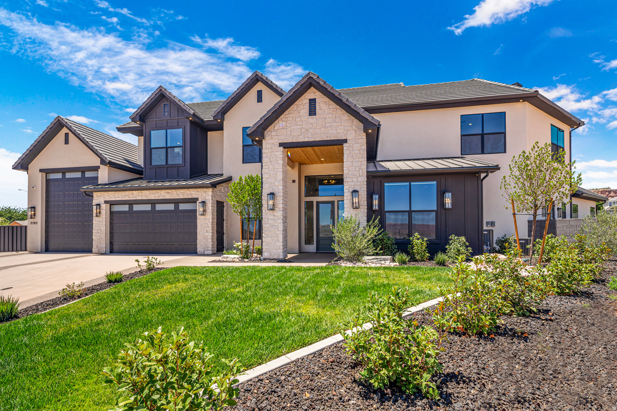 Experience elevated living in this stunning open-concept home designed for both everyday comfort and unforgettable entertaining. The spacious great room flows seamlessly into a gourmet kitchen with an oversized island and designer finishes. Step outside to your private backyard oasis featuring a pool, spa, waterfall, and an outdoor kitchen. A raised fire pit area and an in-ground trampoline. Perfect for entertaining. The 46-foot epoxied RV garage has a drinking fountain and built-in storage cabinets.