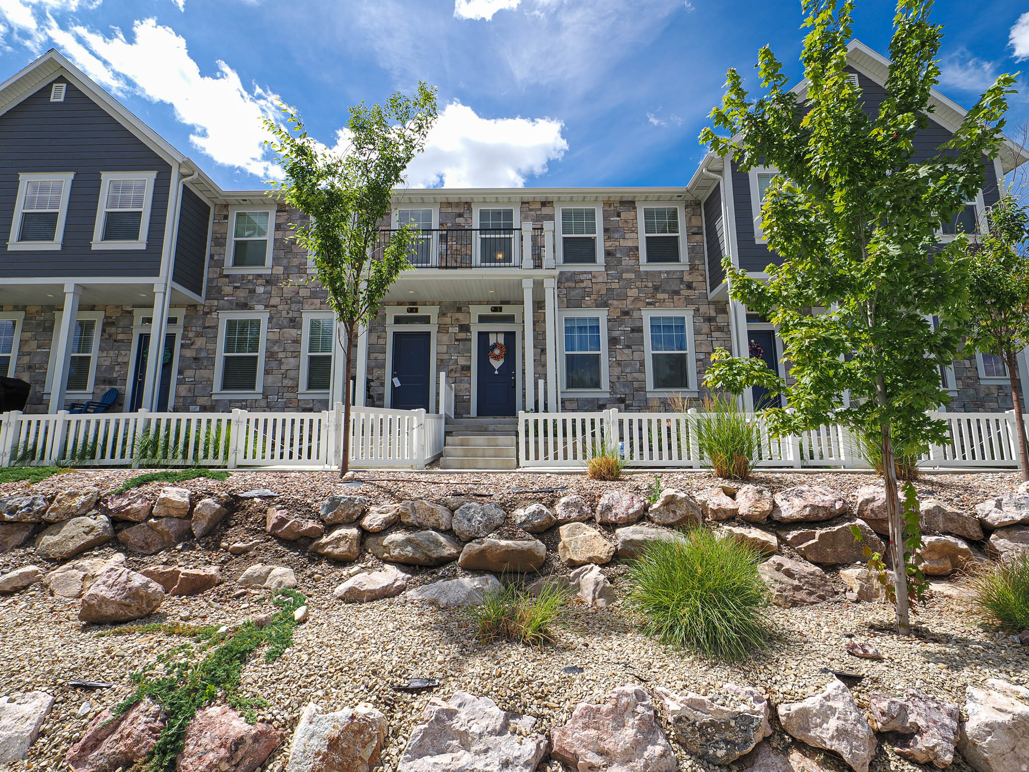 Gorgeous townhome with charm galore in the coveted 5th & Orchard subdivision.  Nestled in the heart of Bountiful, this home will check all the boxes.  The beautiful front patio has been remodeled with a seating wall, firepit, flagstones, drip irrigation, and garden box with upgraded plants.  The main floor with kitchen, dining area and great room, is bright and open and a welcoming area for gatherings.  Quartz countertops, undercabinet lighting, extra recessed can lights, SS appliances, Nest thermostat and MyQ smart garage door opener are just a few of the upgrades.   Other upgrades include Reverse Osmosis water filtration system, radon mitigation system, and multiple roof storage racks in garage.  Upstairs is the laundry room, 2 full baths and 3 bedrooms.  The master suite has vaulted ceilings, a large walk-in closet and double vanity sinks in the master bath.  The unfinished basement is plumbed for a bathroom and kitchenette.  This home is a quick 12 minute drive to downtown Salt Lake City and the international airport.  You'll love the quick access to parks, restaurants, shopping, rec center, nearby schools, and 1-15.  This home has been meticulously cared for by the original owner.  Don't miss this gem!
