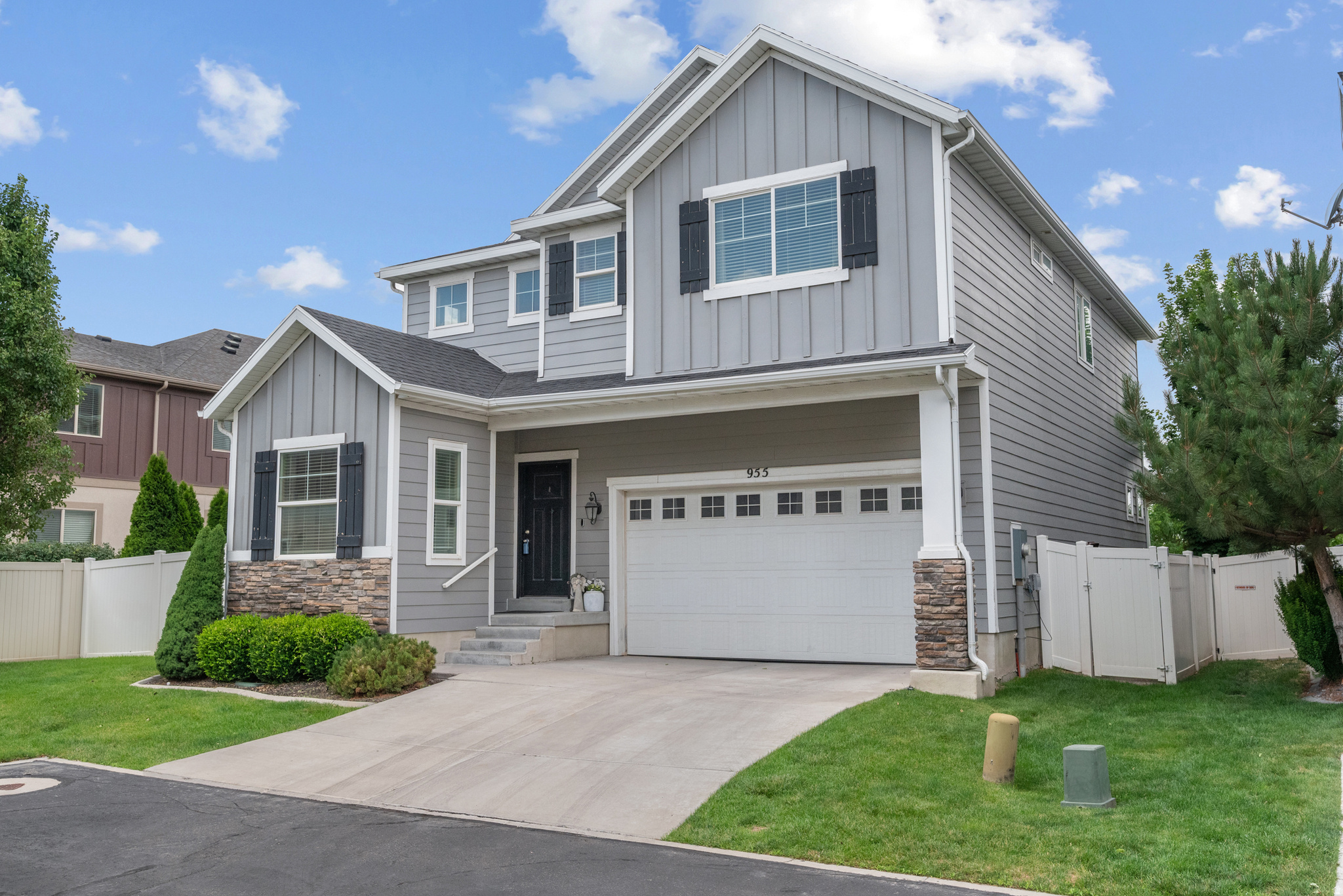 Tucked away in a quiet Midvale neighborhood, this beautifully maintained 4-bedroom home offers the perfect combination of privacy, comfort, and convenience. Backing directly to a park, you'll enjoy the rare luxury of having no rear neighbors and plenty of open space for recreation and outdoor fun.  The spacious primary suite is designed for relaxation, featuring dual vanities, a separate soaking tub and shower, and generous his-and-hers walk-in closets. The open-concept kitchen and living area create an inviting space for everyday living and entertaining, with seamless access to your own private backyard retreat.  Step outside to a stunning patio complete with a pergola featuring remote-controlled shades, making it the perfect place to relax or host family and friends. A natural gas hookup is ready for your BBQ grill or fire pit, and dedicated electrical connections are already in place for a future hot tub. The professionally designed yard even includes a manicured green that's perfect for bocce ball, practicing your putting stroke, or simply enjoying the outdoors.  Located within walking distance of restaurants, parks, and entertainment, and just minutes from shopping and other everyday conveniences, this exceptional home truly has it all. Don't miss your opportunity to make it yours!    Square footage figures are provided as a courtesy estimate only and were obtained from county records.  Buyer is advised to obtain an independent measurement.