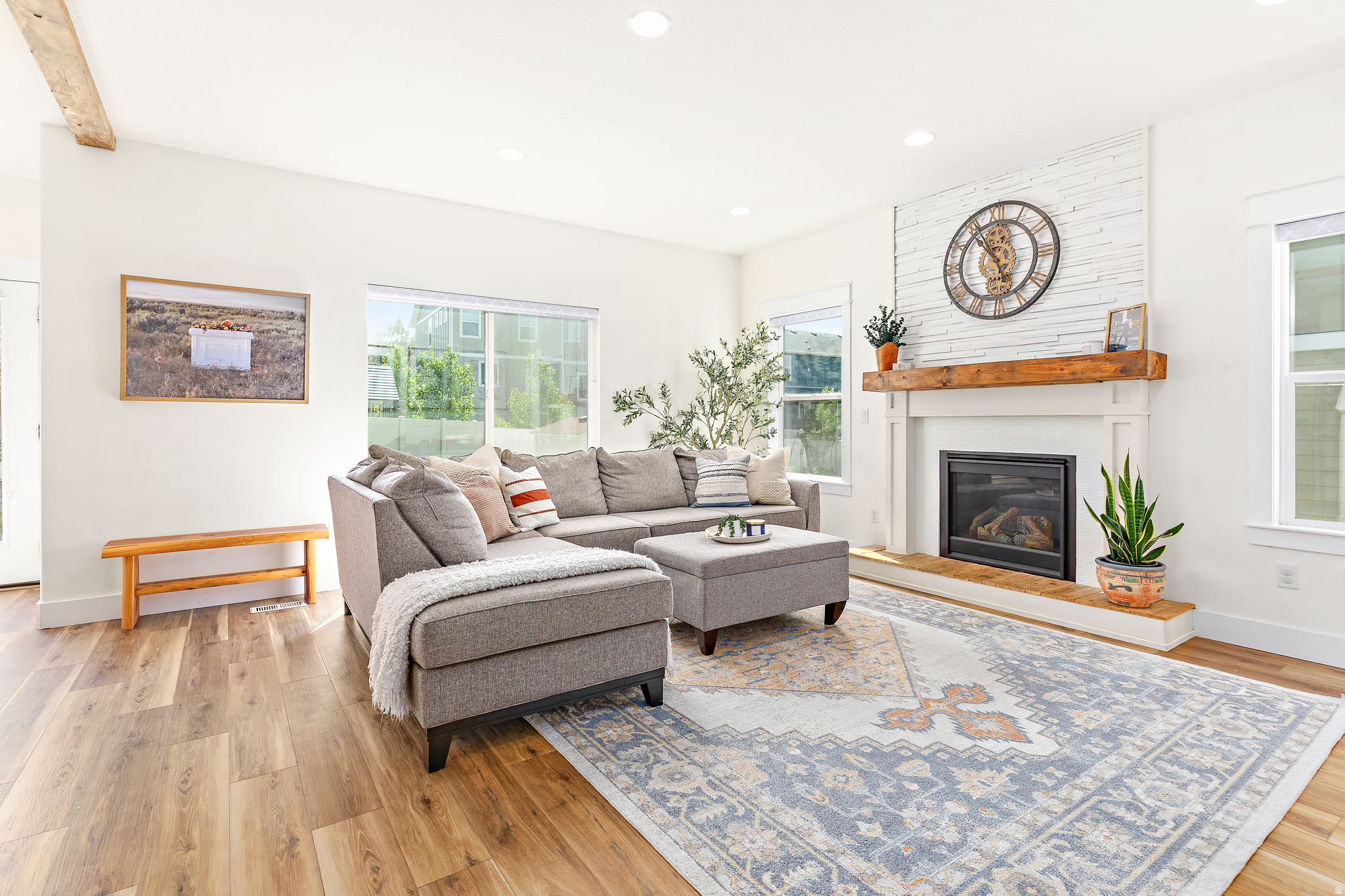 Priced to Sell! During rush hour, it's only about 15 minutes to I-15 and 5 minutes to Mountain View Corridor. Closer to Saratoga Springs than much of Saratoga Springs! PODCAST ROOM! Finally, enough bedrooms, storage, and gathering space for life. Ideally located on the border of Saratoga Springs and Eagle Mountain, this beautifully upgraded home stands out with a podcast studio featuring sound-absorption ceiling panels and wall treatments. This move-in-ready home features custom finishes, built-ins, designer lighting, upgrades throughout, 5 bedrooms, 3.5 bathrooms, and a bright, open floor plan. Inside, you'll find newer vinyl plank flooring, wood beam accents, custom trim work, a cozy gas fireplace, abundant natural light, and a whole-house sound system.  The kitchen is built for both function and entertaining, featuring a large island, double ovens, under-cabinet lighting, extensive cabinet storage, and an oversized pantry.  Upstairs, the spacious primary suite offers abundant natural light, a large walk-in closet, and a spa-like bathroom with a jetted tub and dual-head shower. Additional bedrooms feature large windows, walk-in closets, and generous storage. For added comfort and efficiency, the upper level includes its own HVAC system and dedicated laundry room.  The newly finished basement adds exceptional versatility with a beautiful sound-treated creative space, ideal for recording, streaming, gaming, remote work, movie nights, studying, or simply relaxing. A bedroom, bathroom, wet bar, and large cold storage room make the lower level perfect for guests, multi-generational living, or additional living space.  HOA amenities include a clubhouse, swimming pool, exercise room, playground, bike trails, and community gathering spaces-all for just $24 per month.  Outside, enjoy mature landscaping, garden boxes, a peach tree, raspberry and blackberry bushes, a gas grill, and a large storage shed for tools, toys, and outdoor equipment.  This neighborhood is truly special, with families spanning every age range, from newborns to high school seniors, making it easy for kids to find friends right outside their door. A neighborhood GroupMe keeps everyone connected, whether it's borrowing a cup of sugar, finding a babysitter, joining a playdate group, or hearing about the next event. It's the perfect balance: friendly and connected without ever feeling nosy. During the warmer months, don't miss "Treats on the Streets" every first Monday, where a different street hosts treats and neighbors wander over to mingle and catch up. Add in regular block parties and one of the best Fourth of July fireworks shows around (thanks to some seriously dedicated neighbors), and you'll understand why this community is so hard to leave.  The local school is an easy walk away and has been a favorite, with attentive teachers, supportive administration, and a strong social-emotional learning program woven into the daily curriculum. Evenings are peaceful after 10 p.m., mornings are calm and quiet, and the walking path just across the street is perfect for a sunrise stroll.  Commute: Roughly 15 minutes to the I-15 on-ramp in Lehi during morning rush hour, about 50 minutes to downtown SLC, and just 5 minutes to Mountain View Corridor-closer to freeway access than homes in the heart of Saratoga Springs or central Eagle Mountain. Upcoming upgrades to Pioneer Crossing will shrink that commute even further.  Come experience not just a beautiful home, but a neighborhood you'll want to keep. Don't miss the attached virtual tour!