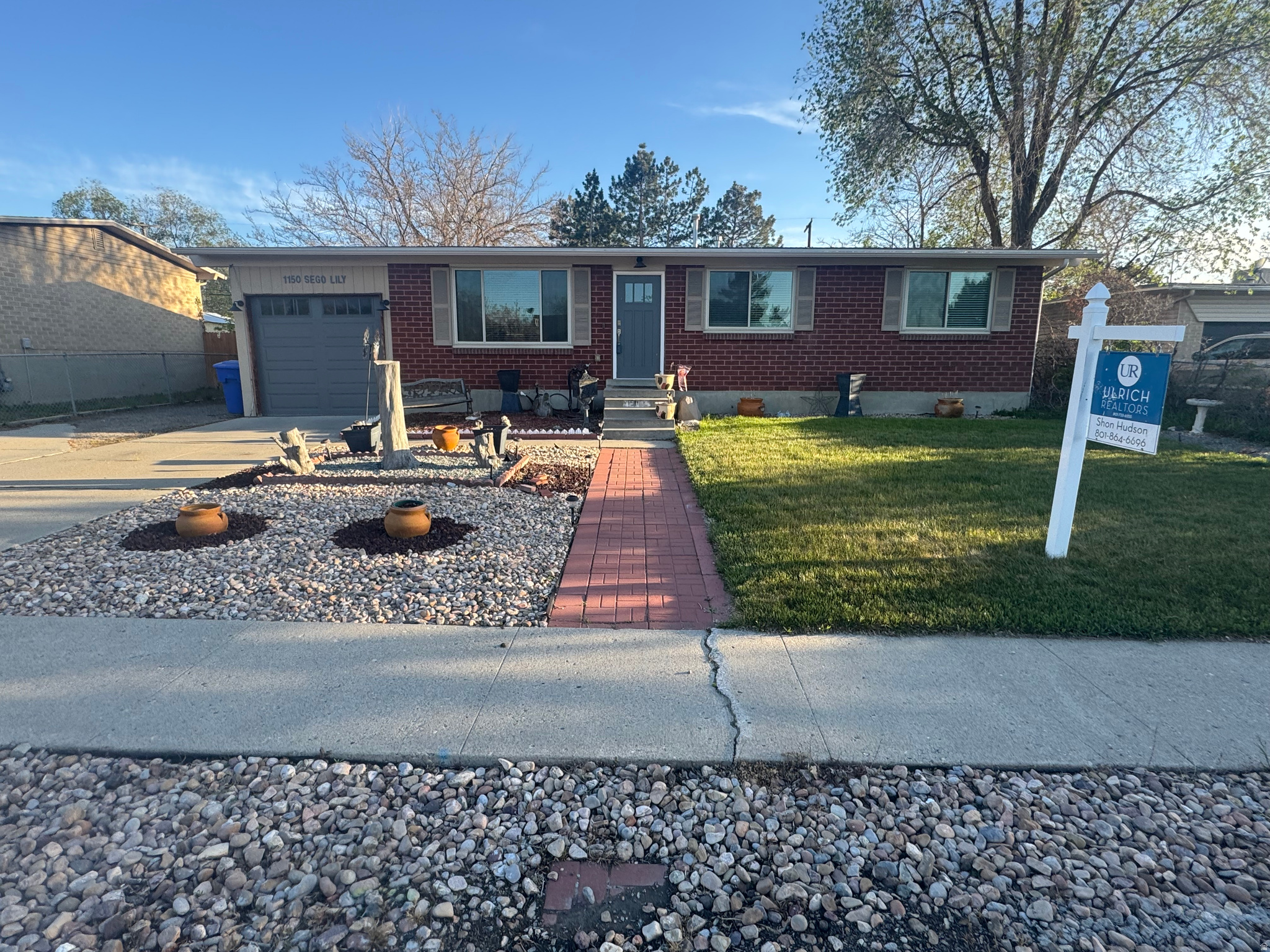 Welcome to this beautifully maintained single-family rambler nestled in the heart of Sandy, Utah. This spacious home offers 5 bedrooms and 3 bathrooms, providing the perfect blend of comfort, functionality, and room to grow. Step inside to discover a bright and inviting layout with generous living spaces, ideal for both everyday living and entertaining. The main level features a well-appointed kitchen, comfortable living area, triple pane windows and ample natural light throughout. With five bedrooms, there's plenty of flexibility for family, guests, a home office, or hobby space. Downstairs, you'll find additional living space perfect for a second family room, game area, or private retreat. The home's thoughtful layout makes it easy to accommodate a variety of lifestyles. Enjoy a beautifully landscaped yard that truly sets this property apart. Whether you're hosting summer barbecues, relaxing in the evening, or letting kids and pets play, the backyard offers both privacy and charm.  Located in a desirable neighborhood with convenient access to schools, parks, shopping, and outdoor recreation, this home combines suburban tranquility with everyday convenience. Don't miss the opportunity to make this versatile and inviting rambler your next home. Square footage figures are provided as a courtesy estimate only and were obtained from county records.  Buyer is advised to obtain an independent measurement. Buyer and buyer's agent to verify all information.