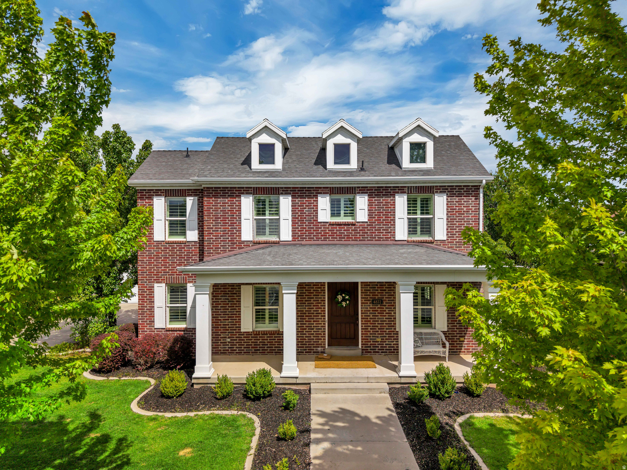 ***NO SHOWINGS FROM JUNE 25-28*** Beautiful and time-less all-brick two-story home located on a charming tree-lined street in the heart of Daybreak. Offering over 5,000 square feet of living space, this home features 6 bedrooms, 4.5 bathrooms, a dedicated main-floor office, and a spacious 3-car garage.  Inside, you'll find hardwood floors, cherry cabinets, granite countertops, and a well-appointed kitchen with all appliances included. The open layout provides plenty of space for both everyday living and entertaining.  The mature trees and landscaped yard create a welcoming outdoor setting, while Daybreak's incredible amenities are just outside your door. Enjoy access to five community pools, Oquirrh Lake, over 50 miles of walking and biking trails, pickleball courts, parks, and year-round community events.  This is a rare opportunity to own a spacious, well-maintained home in one of Utah's most sought-after Daybreak streets.  Square footage figures are provided as a courtesy estimate only and were obtained from previous appraisal/ listing.  Buyer is advised to obtain an independent measurement.