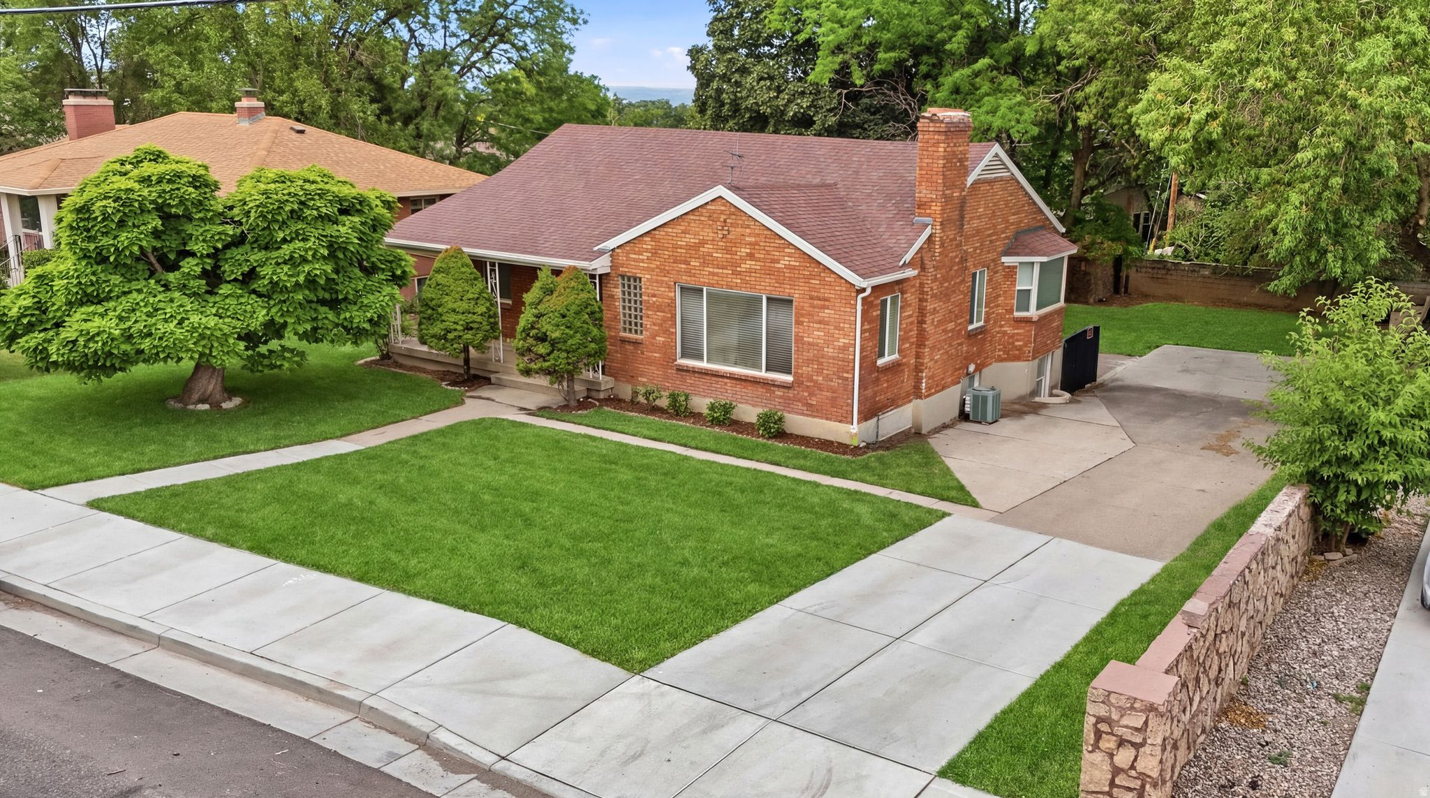 NO SHOWINGS WILL BE SCHEDULED PRIOR TO THE OPEN HOUSE SATURDAY JULY 18TH 10:30-12:30. Located in one of Holladay's most desirable and established neighborhoods, this all-brick rambler offers exceptional value and incredible investment potential. Lovingly maintained and successfully used as a rental property for years, this home is ideal for investors or owner-occupants looking to offset their mortgage with rental income.The main level features beautiful hardwood floors, three bedrooms, and full bath upstairs. Downstairs features a 3/4 bath, newer carpet and fresh paint, a second kitchen, and a private basement entrance-creating an excellent opportunity for a separate living space or income-producing rental unit.Whether you're searching for a primary residence, multi-generational living, or a property with strong cash-flow potential, this home checks all the boxes. Opportunities like this at such an attractive price point in sought-after Holladay are rare. Don't miss your chance to own a versatile property in one of the Salt Lake Valley's hottest markets!