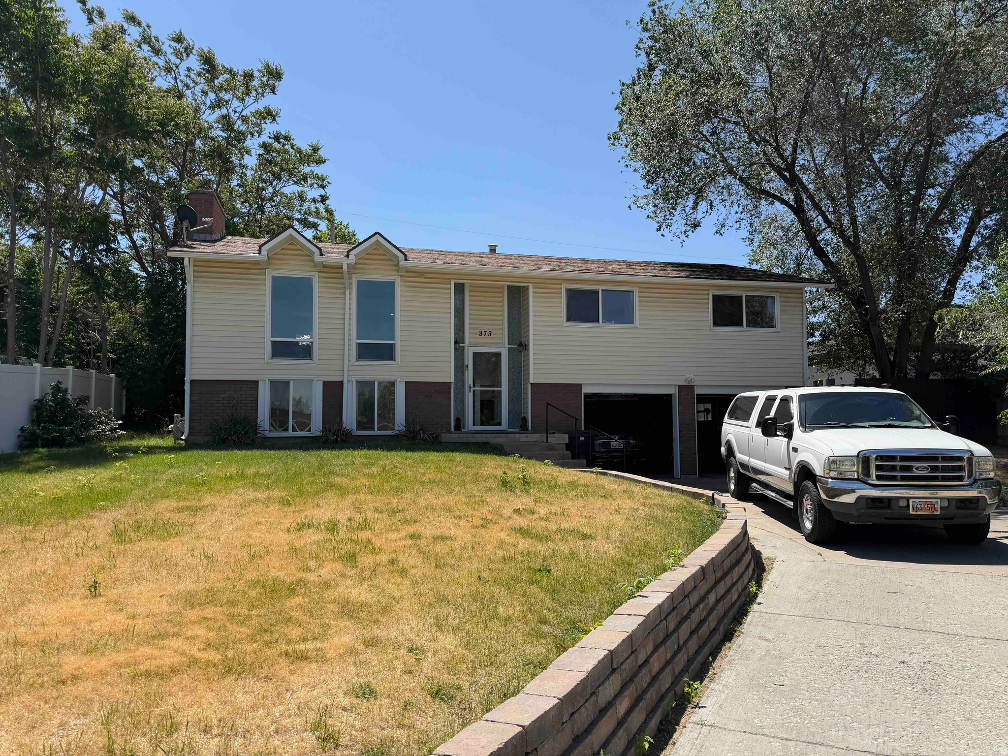 Nestled in a quiet cul-de-sac in desirable Bountiful, this 4-bedroom, 3-bath split-level home offers space, comfort, and convenience in a fantastic location. New kitchen remodel, cabinets, counters, and appliances. Freshly painted, new carpet. Situated on a generously sized lot with covered gazebo. Walking distance to nearby schools. This home combines peaceful neighborhood living with easy access to everything Bountiful has to offer.   Square footage figures are provided as a courtesy estimate only and were obtained from a past appraisal.