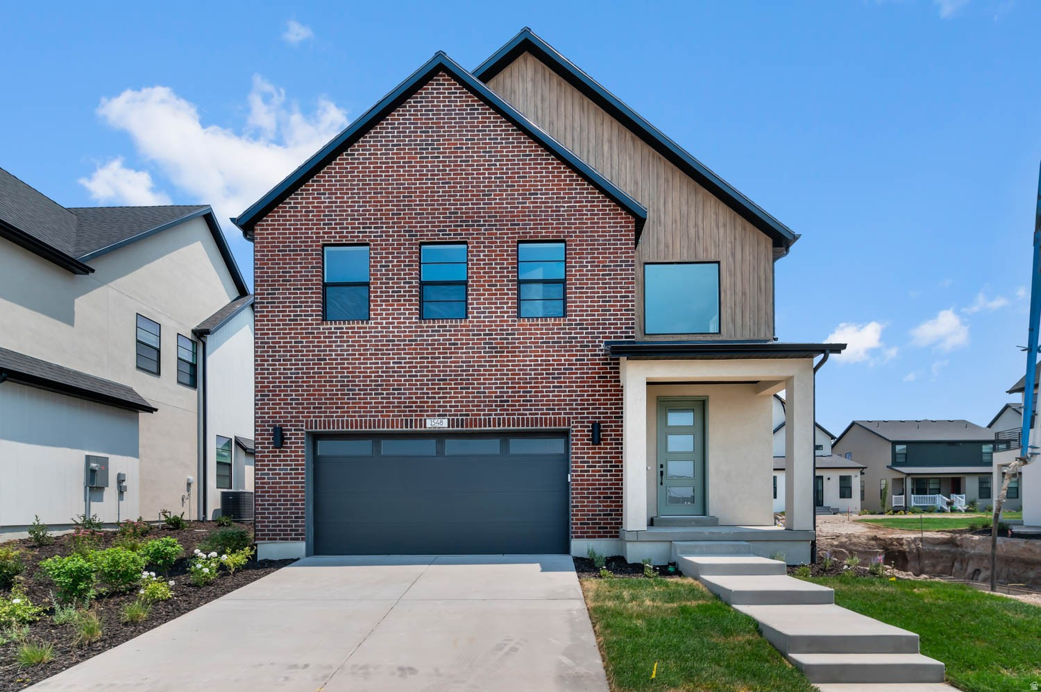 Come see this beautifully designed Gteborg home, offering a perfect blend of modern style, energy efficiency, and thoughtful upgrades throughout. The gourmet kitchen features elegant gray laminate cabinetry, stunning quartz countertops, a designer tile backsplash, and premium platinum gas appliances, creating a space that is both functional and stylish. The home's interior showcases a sophisticated mix of laminate hardwood, tile, and carpet flooring, complemented by can lighting, and large Craftsman-style baseboards and casing. A striking metal railing enhances the stairway, adding architectural appeal and an open feel. Retreat to the spacious owner's suite featuring a luxurious bathroom with cultured marble surrounds and black matte hardware for a clean, timeless finish. Additional conveniences include Christmas light outlets, a tankless water heater, and multiple energy-efficient features designed to help reduce utility costs while enhancing everyday comfort. Comes fully landscaping for an easy move in experience!