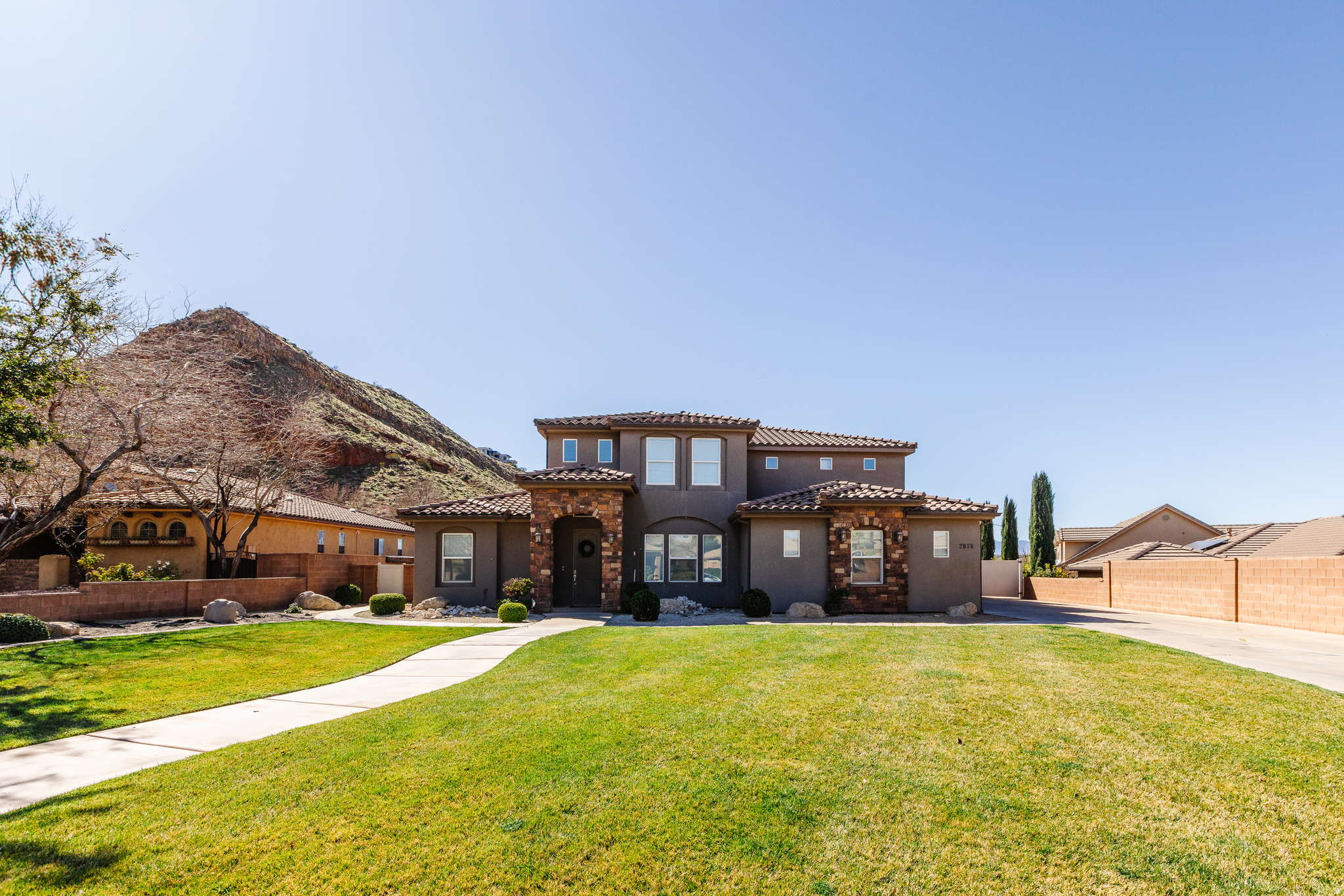 Price improvement! Step into paradise with this stunning 5 bedroom, 4 bathroom home with an office in the highly desirable Desert Fields subdivision where modern style meets everyday comfort. This home provides spacious living areas filled with natural light, contemporary finishes and an open-concept layout with many upgrades. The gourmet kitchen feature including ample cabinetry, walk in pantry which flows seamlessly into the main living area. The large yard accommodates a large sparkling pool w/slide, relaxing hot tub, complimented by a covered patio ideal for outdoor dining. With plenty of parking space and generous outdoor areas this home is perfectly suited for gatherings of any size.