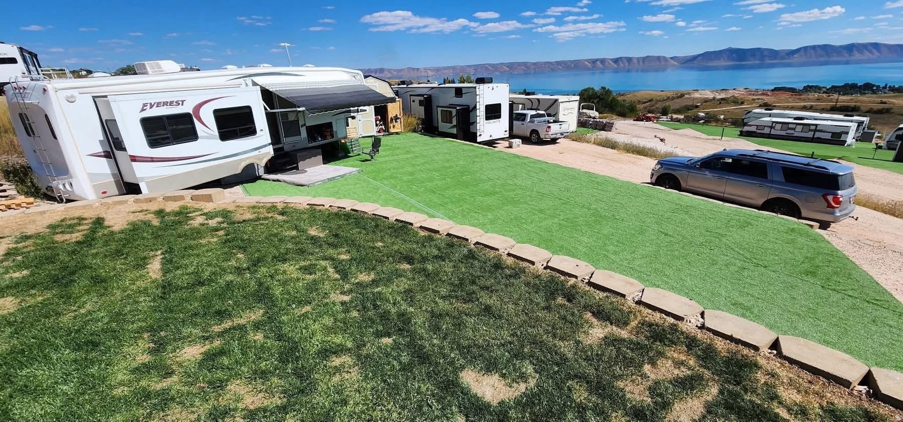 Two improved RV lots being sold together in desirable Bear Lake RV Park! Take in the stunning views of Bear Lake and the surrounding mountains while enjoying power and water already installed. Plenty of room to spread out and enjoy all that Bear Lake has to offer, making this the perfect seasonal retreat or vacation escape. Direct access to fish haven Canyon for hundreds of miles trails and recreation. Each lot has an Old Hickory Shed that is included on it.
