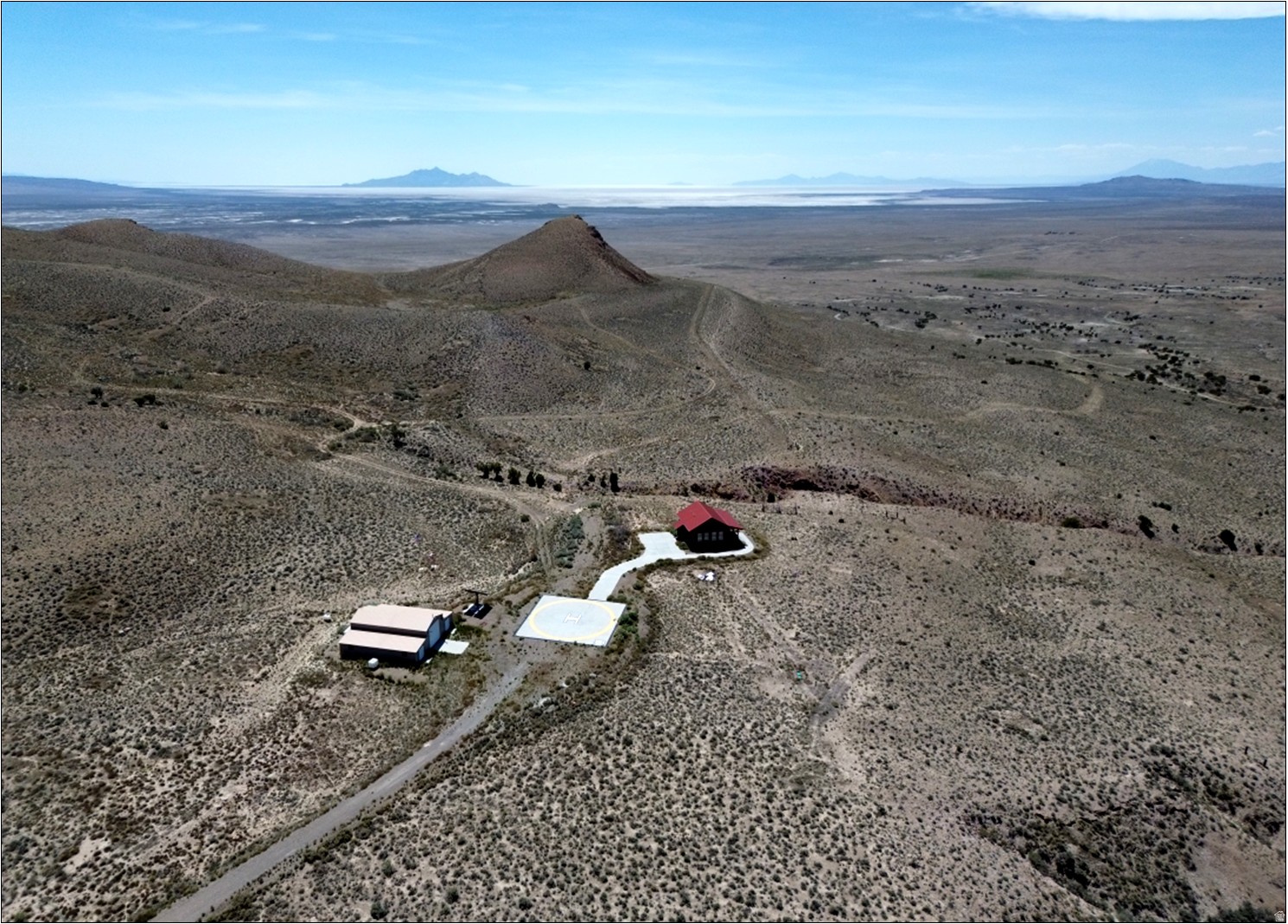 Beautiful, unique, & off-grid 640-acre ranch with improvements located in the Matlin Mountains, Box Elder County, Utah. Unobstructed & expansive 360 views over desert recreation area. Well-built 1-bed/1-bath 725 SF home (2019), 1,520 SF shop (2012), helicopter pad, water/pond storage, & modern off-grid private solar power/water system (out of operation - see page 9). Water right: #13-3889 - 0.25 acres irrig, 6 ELUs, 1 EDU. Water right: #13-4066 - (19.21 AF) 5 acres irrig, 135 ELUs, 1 EDU. Parcels 04-011-0066 & 04-011-0067 (2025 Taxes: $1,679). Zoned MU-160 (160-acre min lot size) in Box Elder County. Dramatic topography & mtn landscape (5,039 to 5,400 feet ASL). 30 miles SW of Snowville, Utah, 66 miles W of Brigham City, Utah. 70 miles NE of Wendover, Nevada, 100 miles NW or SLC, Utah.