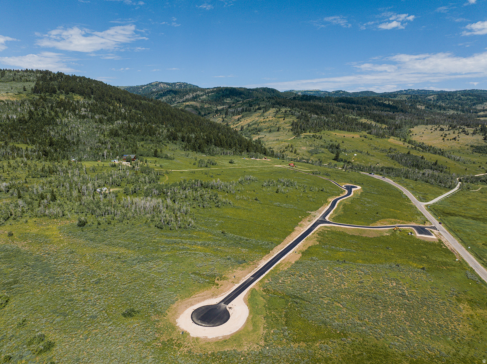 Lot 4 of the prestigious Rockwell Ridge community - only two lots left! Power is stubbed at each lot and a brand new, beautifully paved interior road gives you uninterrupted pavement access all the way from your lot to the shores/marina at Bear Lake! Stunning 4.9 acre lot right at the mouth of Emigration Canyon in Bear Lake County, in the quaint community of Sharon (Liberty), ID! 4 National Forest canyons within a stone's throw make these lots an outdoor recreation dream! Whether you're into snowmobiling, ATV's, horseback riding, hiking, or you just want 5 acres to keep the neighbors away from your future dream home, these lots are what you've been waiting for! You'll love the views and serenity from this perfectly gradually sloped property, while also having Bear Lake close, 25-30 minutes away, yet far enough to be totally insulated from the crowds. Montpelier is 15 minutes away and Preston 35 minutes. Each lot will need to drill their own well and provide their own individual septic system. All lots have been successfully PERC tested and the final plat fully approved and recorded! Call or drive by to see this one of a kind property today!! Agents related to seller.