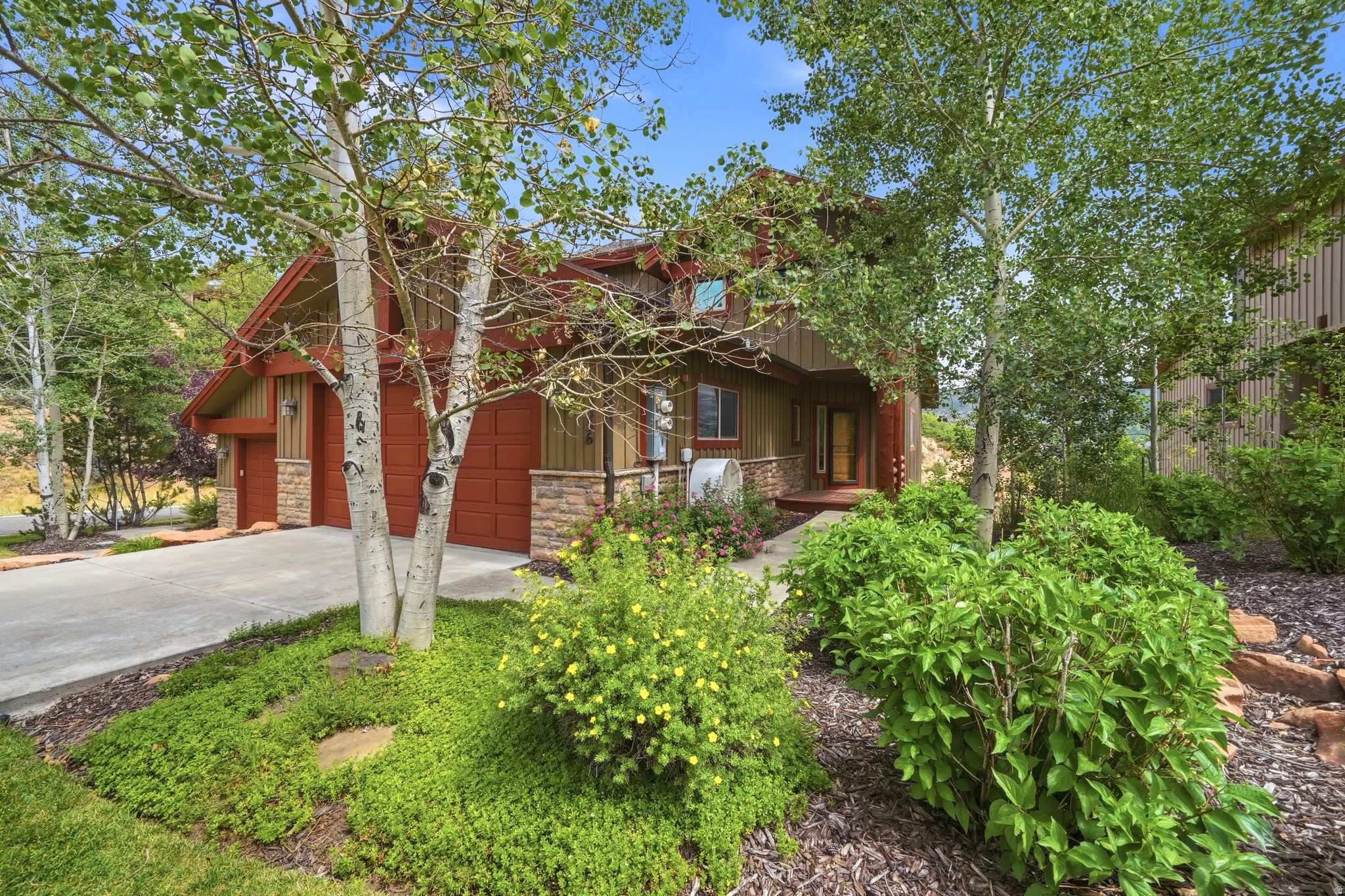 Discover refined mountain living in this beautifully upgraded 3-bedroom, 2.5-bath townhome in the highly sought-after Cedar Ridge community of Pinebrook. Designed with comfort and elegance in mind, the open-concept main level features soaring vaulted ceilings, rich hardwood flooring, expansive windows that showcase mountain views, and a stunning gas fireplace that creates a warm, inviting atmosphere. The remodeled gourmet kitchen offers granite countertops, quality finishes, and seamlessly connects to the dining and living spaces, making it ideal for entertaining. Step onto the spacious deck to take in the peaceful alpine setting, or relax on the private lower patio in your 6-person hot tub. Thoughtful upgrades throughout include a luxurious remodeled primary suite, new furnace, central air, upgraded windows, custom lighting, and premium finishes. Complete with a spacious family room, oversized 2-car garage, and direct access to Park City's world-class trails, skiing, dining, shopping, and transit, this exceptional home offers the perfect blend of luxury, convenience, and mountain lifestyle