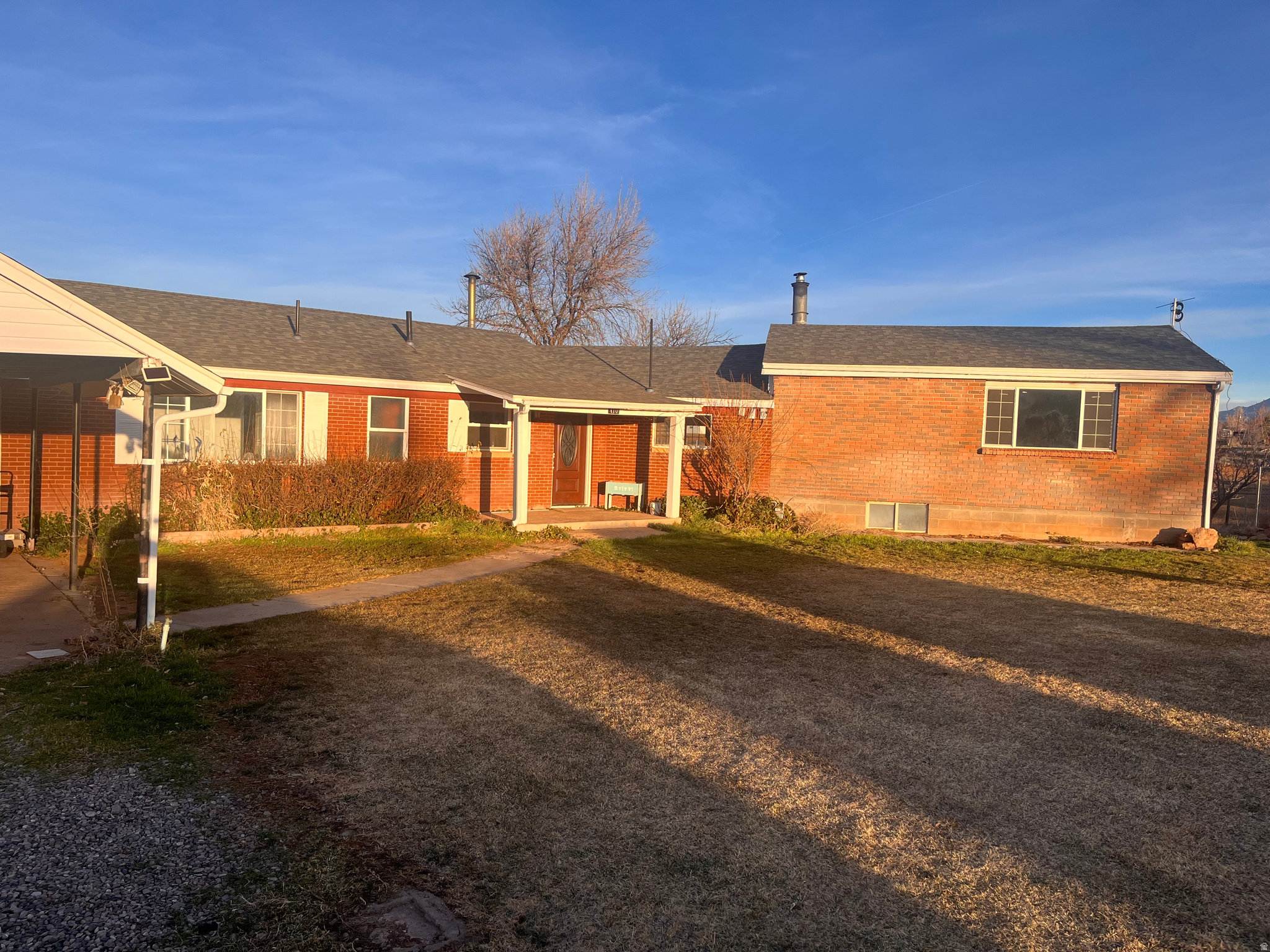 Spacious Cul-de-Sac Horse Property with Water & Mountain Views on .96 Acres  Located at the end of a quiet cul-de-sac in Blanding, Utah, this beautifully maintained 3,578 sq ft home sits on .96 acres and offers space, privacy, and stunning water and mountain views.  Designed for comfortable family living, the property includes well water for sprinklers and livestock in addition to city culinary water-ideal for horse enthusiasts. The kitchen features rich cherry wood cabinetry, an induction cooktop, and a convection double oven. Central A/C and gas heat provide year-round comfort.  Enjoy movie nights in the theater room with projector, you will appreciate thoughtful upgrades like new carpet, a power-flush toilet and electrolysis laundry system.  Outside you'll find automatic sprinklers, mature fruit trees (cherry, apricot, and apple), a fenced dog run or garden area, an exterior basement entrance, and plenty of room for animals or recreation. The home is serviced by a septic system.  Peaceful, spacious, and move-in ready-this is Southeast Utah living at its best.