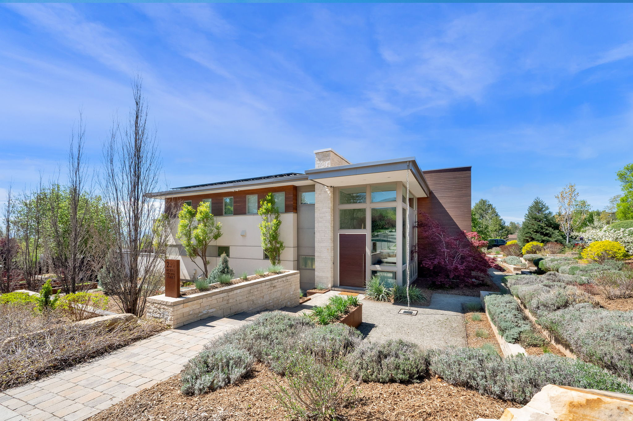 Built in 2012, this 8,000 square foot contemporary Avenues home starts off strong with a glass-walled vestibule with inset floor lighting, a statement chandelier, and a two-story ceiling.  The walls of the living and dining room slide open to the patio and pool and remove the division between indoor and outdoor.   Five of the six bedrooms have ensuites. The one bedroom that lacks a bathroom makes up for it with a private balcony.  This was a show home the Miele used to demonstrate its understated luxury appliances, including a hidden fridge and in-wall coffee maker.  The heated in-ground pool has an automatic cover, so you don't have to worry about your dog in the yard while you are in the basement climbing the rock wall or picking out the right bottle from the wine cellar.  This expansive home in the Avenues isn't just unique because it was one of the filming locations for the horror film Hereditary (worth a google) but also because it is not the kind of home you typically find in the Avenues at all.   The home is amazing on its own. The neighborhood is amazing on its own. But both combined? Mythic.