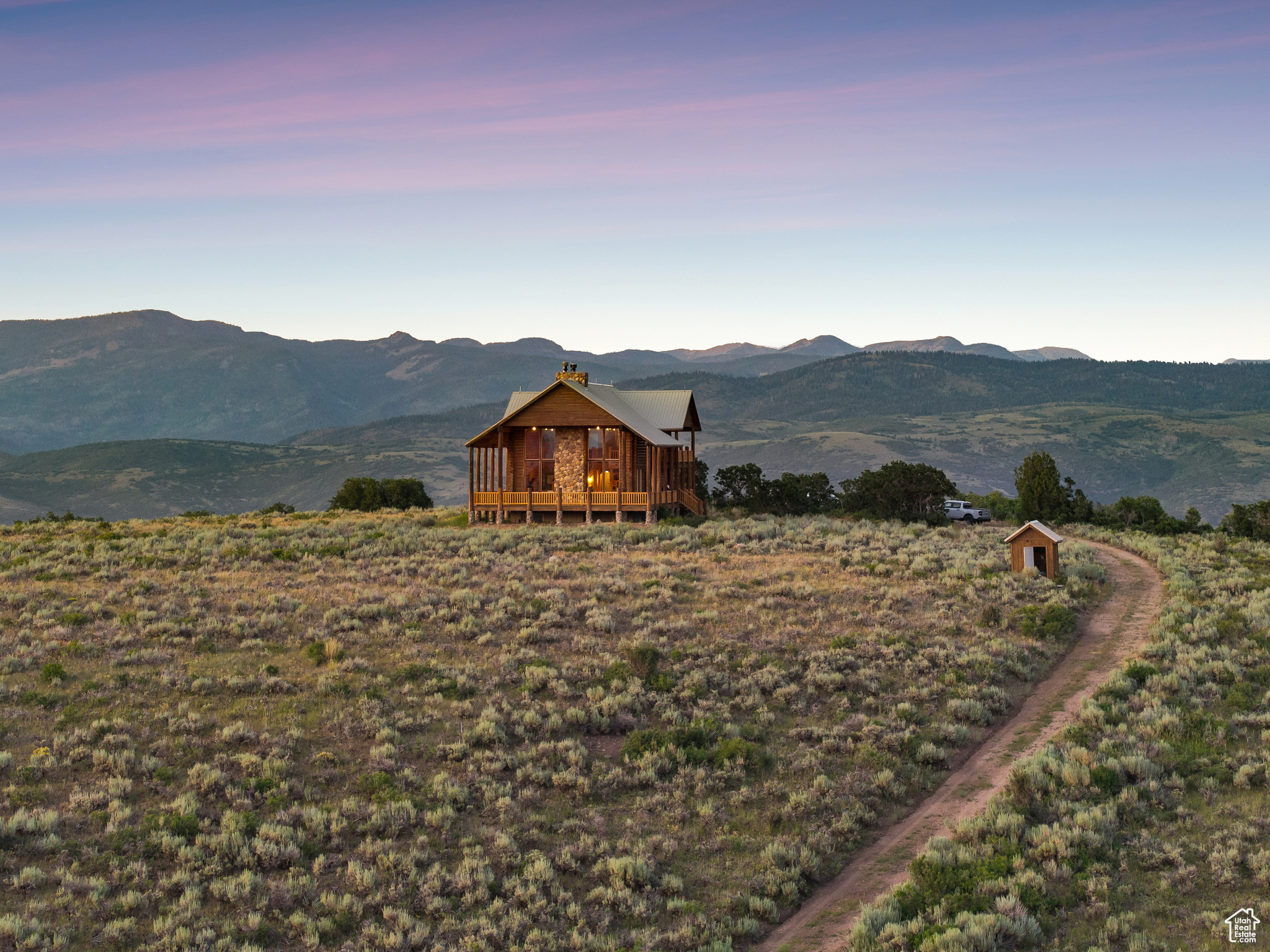 Escape to 163 acres of pristine wilderness with breathtaking panoramic 360 views in Woodland. You will find pure serenity on the massive wrap-around deck featuring unobstructed views of the Uinta and Wasatch Mountains, including Mount Timpanogos. This spacious log cabin is offered fully furnished and features an unfinished basement providing plenty of room to expand. Enjoy off-grid independence with a private well, cozy wood fireplace, propane appliances, and a generator. Extensive hiking and cross country skiing are right outside your door. This unique retreat is forever protected by a Utah Open Lands Conservation Easement. Do not miss this once-in-a-generation opportunity. https://youtu.be/adMy39lUDkM