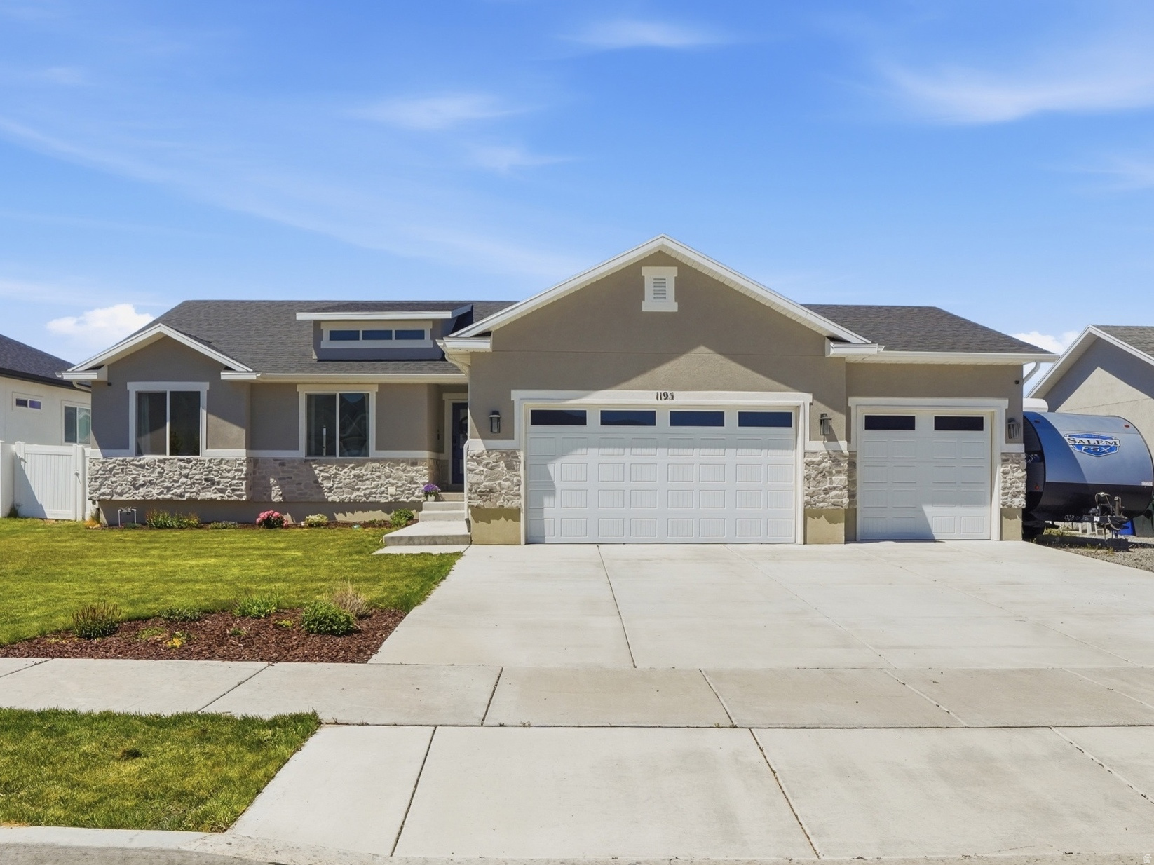 Beautifully designed rambler with fully usable, spacious backyard and incredible outdoor living space! Complete with a huge deck, garden area, fruit trees, shed, and RV gate... perfect for entertaining, relaxing, and enjoying the outdoors. Inside, you'll love the open and inviting floor plan with a kitchen that is both stylish and functional, featuring quartz countertops, tile backsplash, and a seamless flow into the main living area. The main level offers 3 bedrooms, including a large primary suite, plus convenient main-level laundry. The basement takes this home to the next level with 2 additional bedrooms, a spacious family room with a second fireplace, wet bar, wine cellar, and abundant storage, perfect for entertaining, hosting, or creating the ultimate hangout space. Generously sized bedrooms throughout offer comfort and flexibility for any lifestyle. Additional highlights include an extra-large 3-car garage with plenty of room for vehicles, storage, and all your gear. Home also features a whole house water filter. This home truly stands out with its thoughtful design, incredible use of space, and rare backyard setup. Homes like this don't come along often!