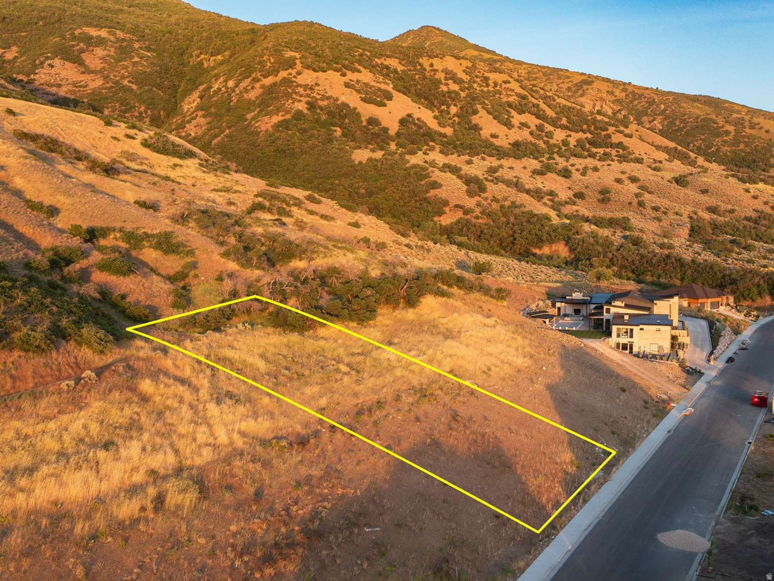 Build your dream home on this premier half acre mountainside lot in the highly sought-after Rock Loft Ridge Estates in Fruit Heights. This elevated property showcases sweeping views of the valley, surrounding mountains, and unforgettable sunsets. It is located in a beautiful, quiet setting that offers privacy and solitude. Enjoy hiking and biking trails just steps away while still being minutes from U.S. Route 89, SLC Airport, shopping and dining at Station Park, and commuter access via the Front Runner. With limited land availability in Fruit Heights, a generous lot size in a premier hillside setting like this one is rare to find. Make your dreams come true--design and build on your home with the freedom to choose your own builder.