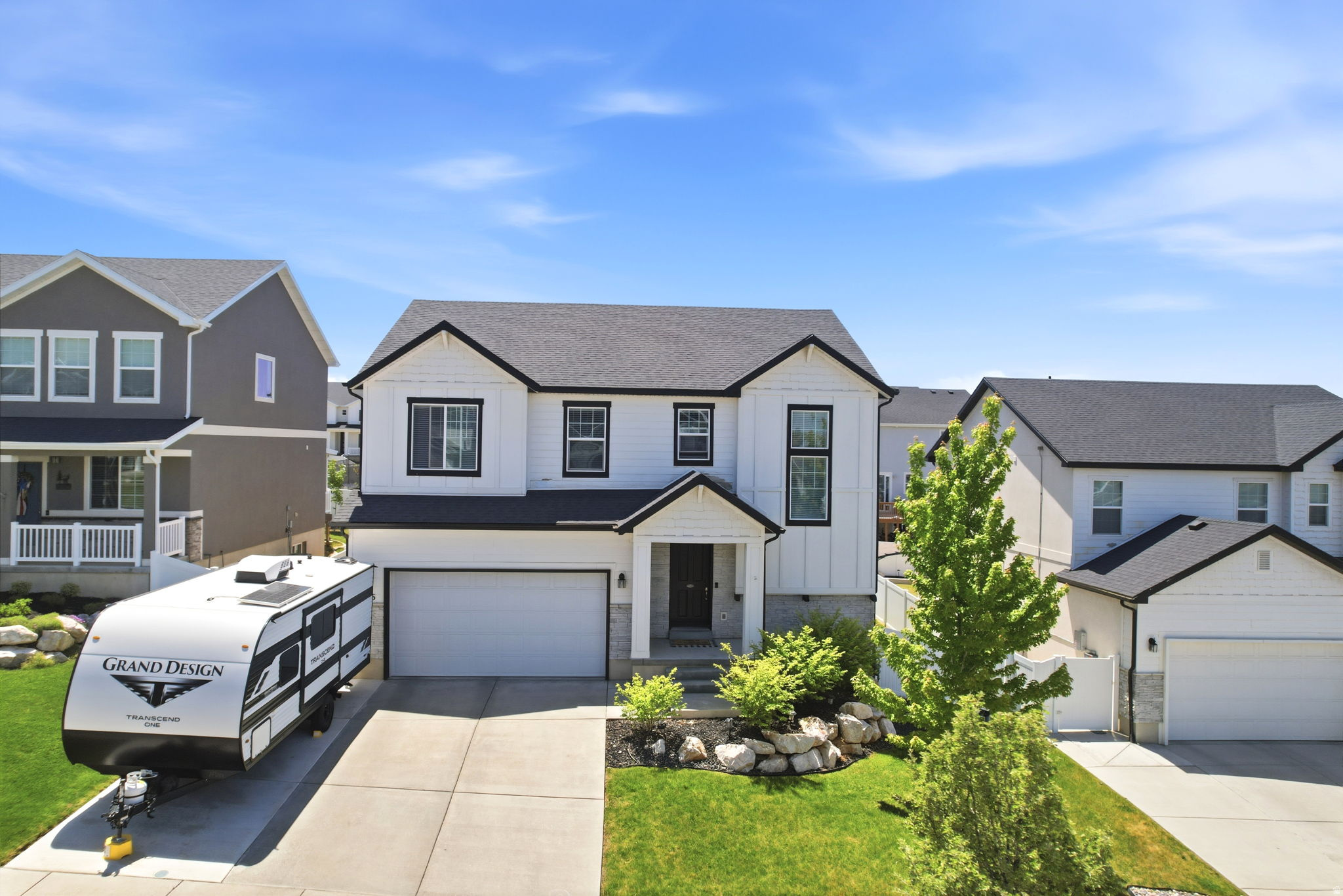 Discover this beautifully upgraded 4-bedroom home in a prime Layton location! Conveniently situated near Hwy 89, SR-193, and Hill Air Force Base, with quick access to shopping, dining, commuting routes, and just 20 minutes from year-round recreation at Snowbasin Resort. Inside, you'll find upgraded finishes throughout, including quartz countertops that elevate the kitchen space with both beauty and functionality. The fully finished basement offers additional living space and features a second kitchen perfect for entertaining, hosting guests, or creating a versatile gathering area. Thoughtful updates including modern lighting fixtures and ceiling fans throughout every room add comfort and style. Combining convenience, upgrades, and flexible living space, this home offers an incredible opportunity in a highly desirable location.