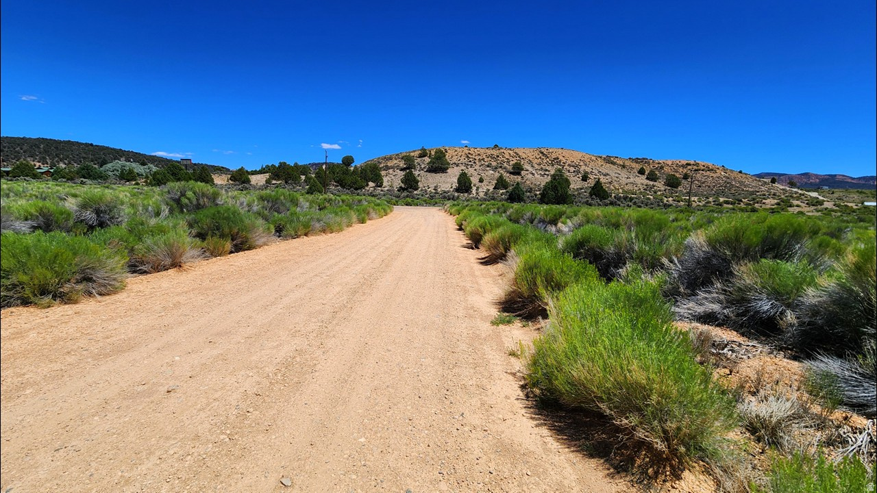 Discover your southern Utah getaway with this rare 0.93-acre property made up of two adjoining lots in the Hercules Subdivision, located near the junction of Highway 89 and Highway 12. This spacious parcel offers great access just off scenic Highway 12 and plenty of room to build a cabin, create a vacation retreat, or hold as a future investment near some of Utah's best outdoor recreation. Enjoy being approximately a 33-minute drive from Panguitch Lake for fishing, boating, and wildlife viewing, less than 25 miles from Bryce Canyon National Park, about 15 miles from Red Canyon, and under an hour from Brian Head Resort for skiing and winter fun. Cedar Breaks National Monument, Zion National Park, and Dixie National Forest are all within reach. With mountain scenery, year-round adventure, and endless recreation nearby, this property is a great opportunity to own land in one of southern Utah's most scenic getaway areas.