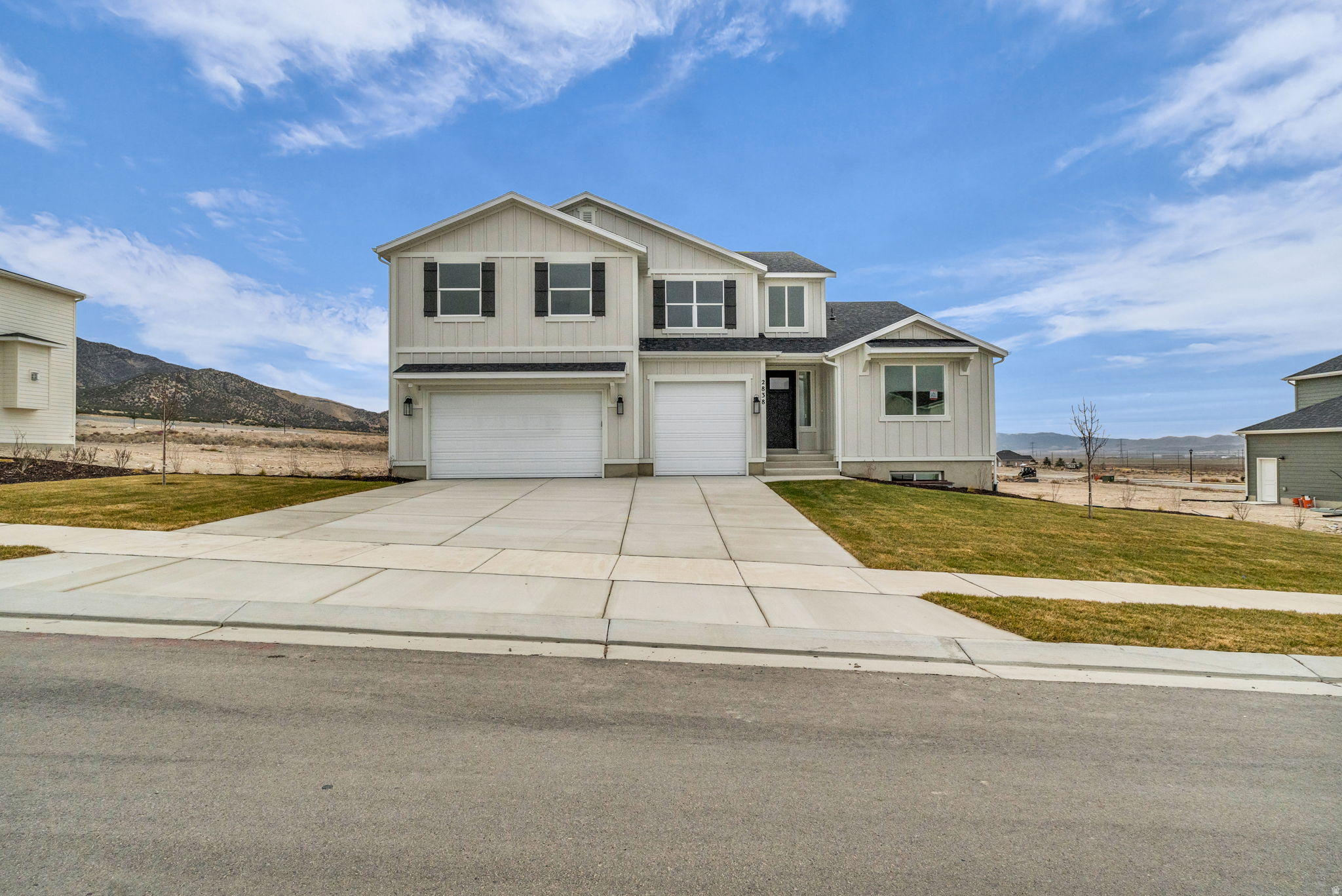 AMAZING $30,000 INCENTIVE TOWARDS CLOSING COSTS, RATE BUYDOWN, OR PRICE REDUCTION REGARDLESS OF LENDER! (Talk to agent for conditions). Must-see Scarlet Ridge Community in Eagle Mountain! Move-in ready! This beautiful home on a three-quarter-acre view lot with a daylight basement is built by Flagship Homes. It features 5 bedrooms, 3.5 bathrooms, quartz slab countertops, painted cabinets, laminate flooring on the main level, a large loft on the 2nd floor, landscaped front yard, a 3 car garage and backyard (can be landscaped for an additional charge). The great room has spectacular windows with a view of the valley and mountains.  The primary bedroom has a vaulted ceiling, large walk-in closet, dual sinks with a separate tub/shower and a stackable washer/dryer in the primary suite. With an large unfinished basement, this home provides space for storage and room to grow. (If preferred, basement can be finished for an additional charge.) 1GB fiber optic internet included in the HOA dues. Call for more information or stop by our model home at 1546 E. Starling Lane, Eagle Mountain for a tour. Model home hours: Monday-Saturday 11 AM - 6 PM. Buyers to verify all information. Square footage is from house plan