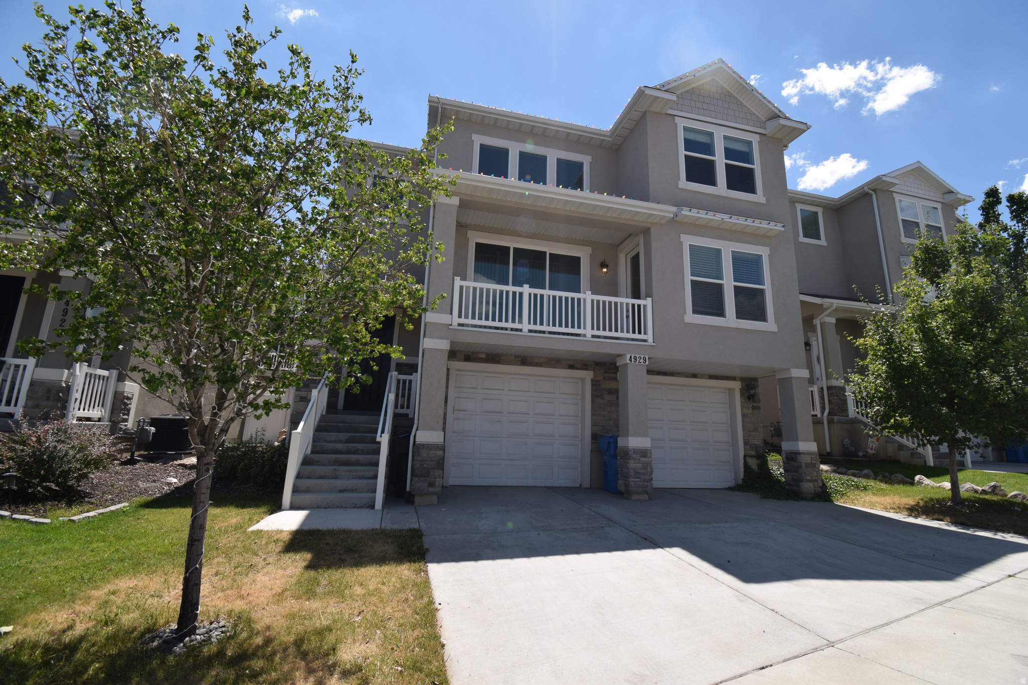 Stunning, well-kept home located in a quiet, friendly Herriman neighborhood close to Mountain View Corridor. Welcome to this beautifully maintained 4 - bedroom, 2.5 bathroom home with additional den/guest bedroom and walkout balcony, oversized tandem garage, and premium upgrades. Living room with vaulted ceiling and windows offers space and natural light. Large kitchen with extra large island, granite countertop space, and cabinets with stainless steel appliances. All the bedrooms and laundry room are spacious. Master suite has walk-in shower, soaker tub, dual vanity sinks, plenty of counter and cabinet space. Extra tub in second bathroom and large laundry room adds to home's functional living. Balcony for private relaxation, fenced in backyard ideal for children, pets, a garden, and backyard parties. Lots of storage including garage, under stairs, furnace room, and a large, dedicated storage room. Located minutes from Mountain View Village with convenient access to shopping, dining, movie theater, and more. Quick access to Mountain View Corridor. A must see for anyone seeking style, space, and convenience in Salt Lake Valley.