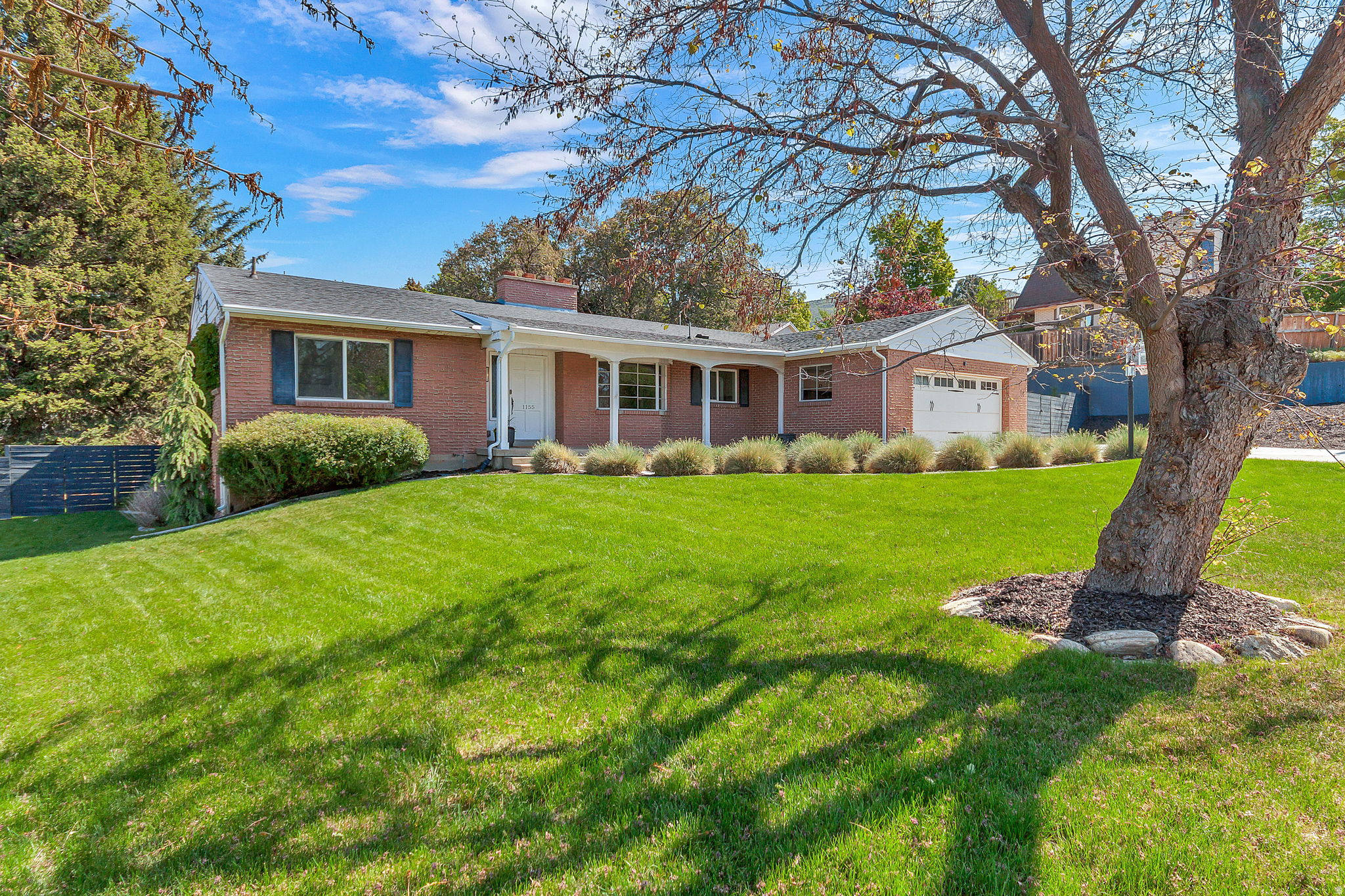 Welcome to this beautifully updated 4-bedroom, 2.5-bath home nestled in a quiet, established neighborhood. Featuring a clean, modern style, this home is filled with natural light thanks to huge windows that showcase the stunning backyard. Inside, you'll find fresh new carpet and paint throughout, complemented by rich hardwood flooring that adds warmth and elegance. The spacious layout offers both comfort and functionality, perfect for everyday living and entertaining. Step outside to a beautifully landscaped backyard-an ideal space for relaxing, hosting, or enjoying peaceful evenings. This move-in ready home blends thoughtful updates with a serene setting you'll love coming home to.