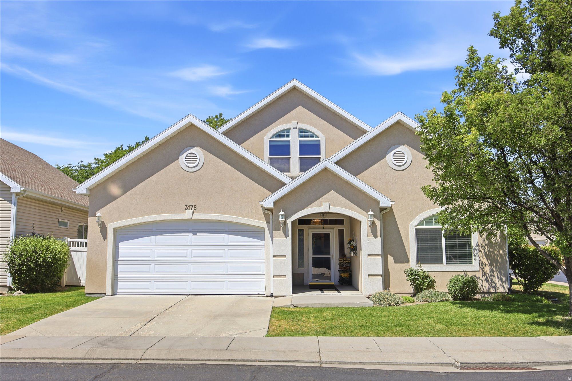 Welcome to this beautifully maintained home nestled in the heart of a peaceful 55+ gated community, where mature trees, privacy, and inviting outdoor spaces create the perfect place to relax and entertain. Whether you're hosting summer barbecues on the extended patio beneath the covered awning or enjoying a quiet evening surrounded by the beautifully fenced backyard, this home offers the ideal blend of comfort and tranquility. Upstairs, you'll also find an incredible amount of storage, including charming built-in window bench storage that spans the length of the wall, perfect for keeping everything organized while adding character and function. Meticulously cared for and thoughtfully updated, the home features numerous improvements since 2018, including new carpet throughout most of the home, new blinds throughout, an updated shower in the front bathroom, and major mechanical upgrades including the furnace, an upgraded larger-capacity A/C unit, water heater, and water softener. Additional updates include a new roof, updated kitchen flooring, refinished kitchen and bathroom cabinets, an induction cooktop, an extended patio with awning, and backyard fencing. This is more than just a home, it's a place to enjoy peaceful mornings, gather with family and friends, and appreciate the ease of living in one of the community's most desirable settings.