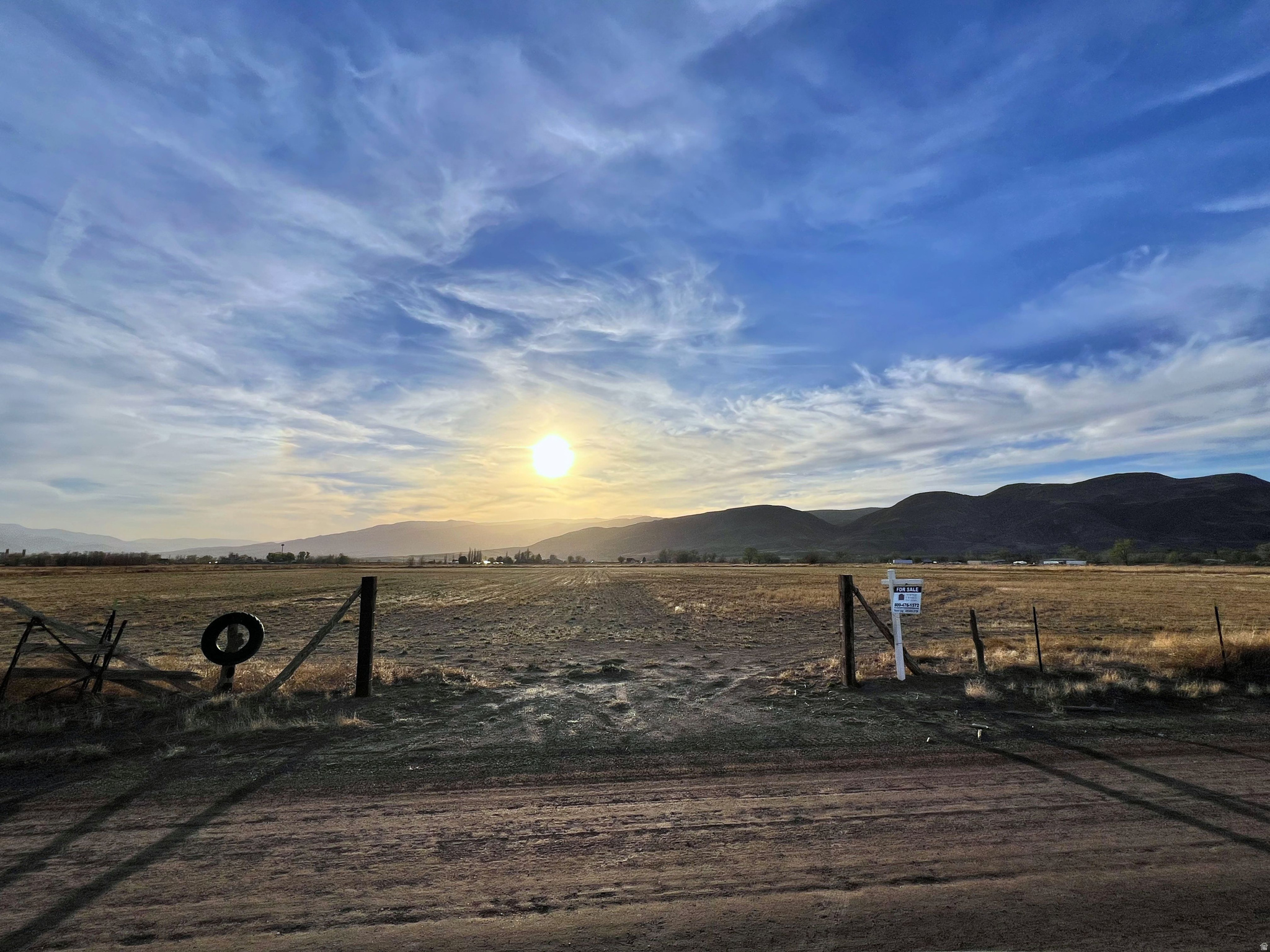 11.52 acres of agricultural land featuring 22 Water Shares (sold exclusively with the land-not separately). With approximately 650 feet of road frontage, this property is primed for subdivision or development.