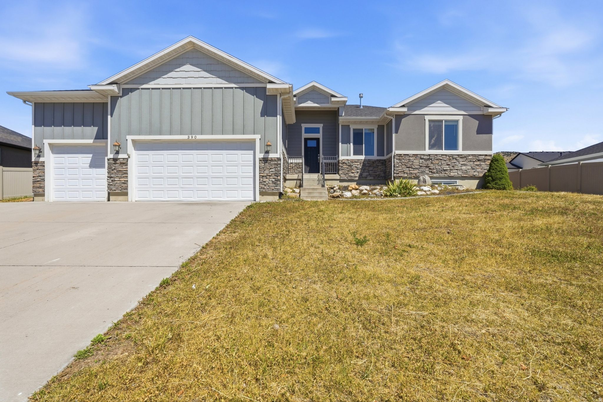 Experience the best of Cache Valley living in this rambler, perfectly situated on Smithfield's east bench where outdoor adventure is always close to home. Whether you enjoy hiking, biking, fishing, or simply taking in the mountain views, you'll love the lifestyle this location offers. Inside, you'll find 5 bedrooms, 2.5 bathrooms, vaulted ceilings, and an open, welcoming floor plan designed for comfortable everyday living. The kitchen is finished with granite countertops and overlooks the main living area, making it easy to stay connected while entertaining. The mostly finished basement adds plenty of living space with a large second family room anchored by a cozy electric fireplace. The basement is also rough-plumbed for a third full bathroom, providing an easy opportunity to add additional value. Outside, the 3-car garage and dedicated RV parking provide plenty of room for all your vehicles and outdoor gear, whether it's campers, boats, ATVs, or mountain bikes. Sandy Park is just a short walk away, offering a playgrounds and open green space. Combining generous living space, and an unbeatable location with easy access to everything Northern Utah has to offer, this home is ready to become the backdrop for your next adventure.   Square footage figures are provided as a courtesy estimate only and were obtained from county record.  Buyer is advised to obtain an independent measurement.