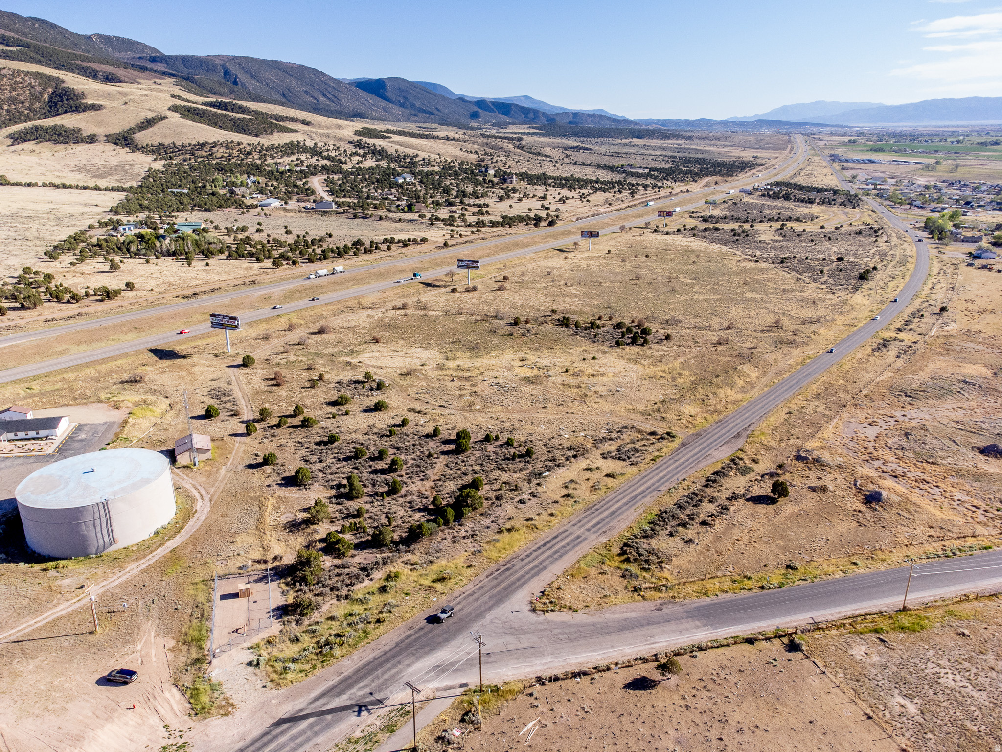 Exceptional 53.45-acre development opportunity in rapidly growing Enoch, Utah. Zoned Community Commercial with frontage on both Old Highway 91 and Interstate 15, this property offers outstanding visibility, access, and long-term upside. Includes 5 large billboards providing additional exposure and potential income. The true value lies in the ability to subdivide into smaller commercial parcels and increase value through improvements such as roads, curb, gutter, sidewalks, and utilities. Ideal for retail, hospitality, storage, office, fuel, or mixed commercial development. Excellent freeway exposure combined with strong future growth makes this a rare investment and development opportunity in Iron County.