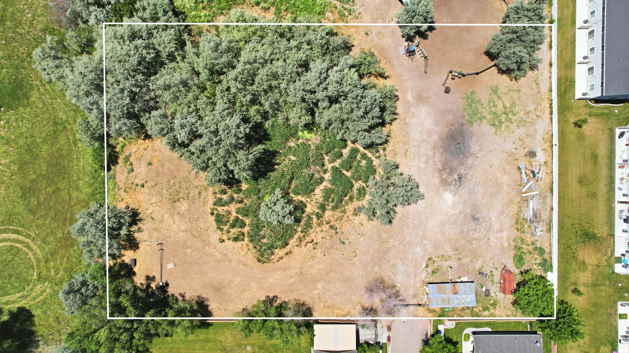 Property to be sold with Parcel #03-115-0005 & Parcel # 03-115-0061, 16.28 acres across 3 parcels in Brigham City. Ideal for grazing, agriculture, or investment. Includes small barn, but front gate and corral. Buyer to verify all details.