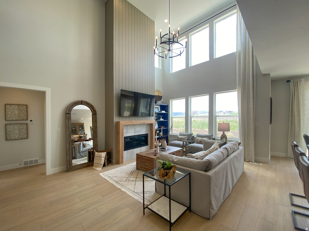 Open House 4/18, 12-4pm, meeting point at Model Home - 917 W Columbia Ct, Riverdale. $50,000 in FREE BASEMENT +PERMANENT RATE AS LOW AS 4.99% THROUGH PREFERRED LENDER*. Limited time offer on select lots through First Colony Mortgage. Subject to market conditions/borrower qualifications. All loans subject to credit and approval.* Completion end of May! $180,000 in upgrades, Main-level living, 3rd car garage + EV charger outlet, 9-ft finished basement, Huge loft on second floor, Soaking tub + separate shower in primary suite, Modern gas fireplace with shiplap surround, Whirlpool gourmet appliances, Countertop stove + soft-close cabinetry, Extended pantry, Smart home system with fiber internet, Mountain view lot, Full surround James Hardie siding, Quartz countertops throughout, Upgraded matching cabinets & countertops in kitchen and bathrooms, Double HVAC systems for efficiency.  Welcome to The Winslow-a standout floorplan offering 5 bedrooms, 4 bathrooms, and 4,105 sq ft of beautifully designed space. From the moment you walk in, the layout feels intentional and elevated. A versatile flex room off the entry sets the tone-perfect for a home office, media lounge, or creative space-paired with a convenient powder room nearby.  The main-level living design is a rare and coveted feature, anchored by a warm, inviting great room with a modern fireplace and shiplap surround. The kitchen delivers both form and function with a statement island, extended cabinetry, a generous pantry, and gourmet Whirlpool appliances-designed for everything from quiet mornings to hosting in style.  Tucked privately on the main level, the primary suite feels like a personal retreat, complete with a spa-inspired bathroom featuring a soaking tub, separate shower, and a spacious walk-in closet.  Upstairs, a massive loft opens up endless possibilities-lounge, workspace, game area-alongside two additional bedrooms and a full bathroom. Downstairs, the finished 9-ft basement expands your options even further with a large recreation space, two bedrooms (including one with an ensuite), a flex room, and ample storage.  Set on a mountain view lot in the highly desirable Riverdale community, this home offers the best of both worlds-peaceful, quiet surroundings with everyday convenience just minutes away. Enjoy quick access to shopping, dining, and freeway connections, all while coming home to a setting that feels relaxed and tucked away.  With its thoughtful layout, elevated finishes, and unbeatable location, this home delivers a lifestyle that feels as good as it looks. *Photos are from other similar floorplans for easy visualization. Will be updated with photos periodically. *Permanent buydown as low as 4.99% (5.273% APR). Limited time offer on select lots through First Colony Mortgage. Subject to market conditions/borrower qualifications. All loans subject to credit and approval.
