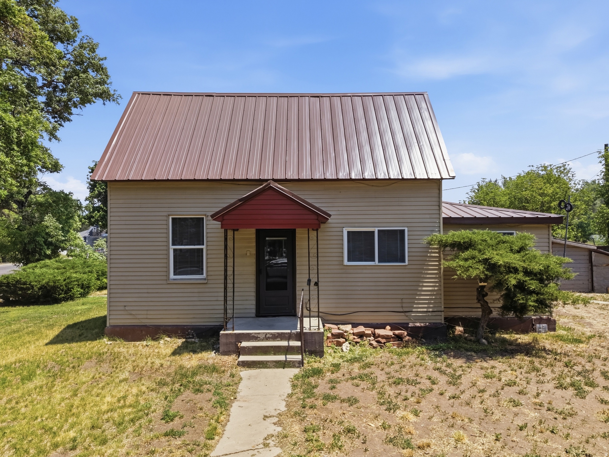 Rare opportunity in Heber City's Central Heber Overlay and TCD (Transitional Commercial District) zone! Situated on a highly visible .91-acre corner lot, this charming 3-bedroom, 1-bath home offers exceptional potential for a variety of future uses. The property's prominent location provides excellent street visibility and accessibility, making it an attractive option for residential living, a professional office, or future redevelopment opportunities. The existing home is full of character and functionality, while the expansive lot offers ample space for parking, expansion, or additional improvements (subject to city approval). Opportunities like this are becoming increasingly difficult to find in the heart of Heber City. 2.5 Water shares available for and additional $30,000