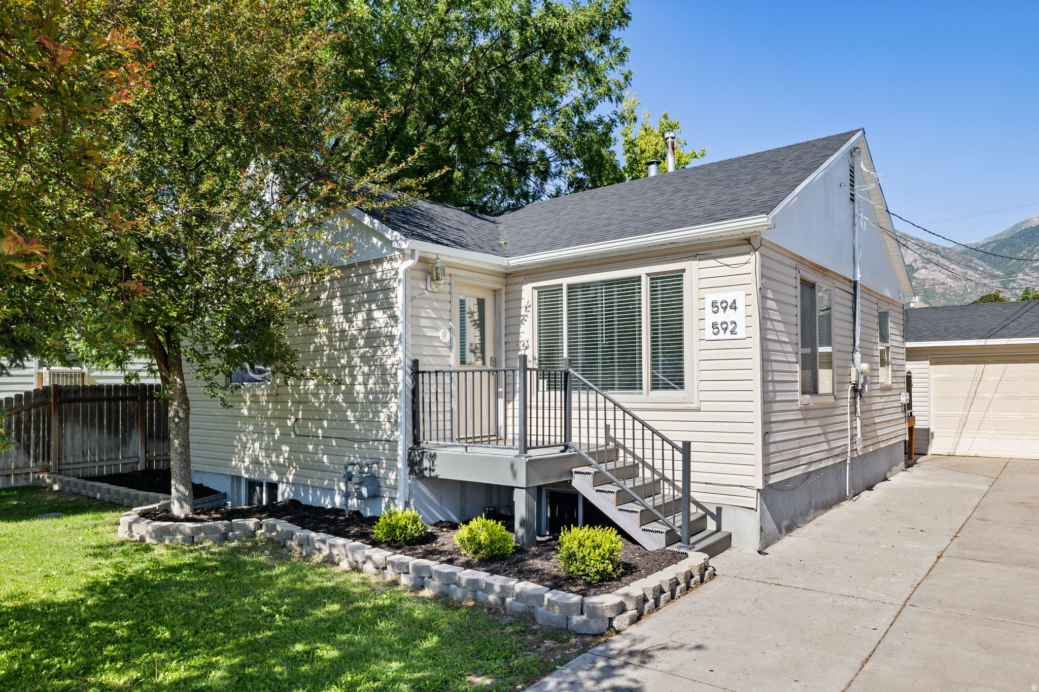 *** NO SHOWINGS TIL SAT JULY 11th *** Income potential + Legal ADU + Great central location (minutes to BYU, parks, schools, shopping, & freeway access). Quiet street, family-friendly, and strong rental demand. Move-in ready! Large 2 bedroom upstairs with a fully legal 2-bedroom ADU (accessory dwelling unit) downstairs with its own private entrance + separate laundry. Large 2 car garage, excellent storage, including attic access with pull-down staircase. Private yard with mature trees, gathering area, fire pit, and garden area. Brand new roof (June 2026), New AC (2022), New Water Heater (2025), fresh paint, siding, and flooring. This home is ready to go! Perfect for owner-occupants or investors! Quick possession available. Buy this home, rent out upstairs for ~$2,000, live in the basement unit for less $1,100/month, and take advantage of home ownership.