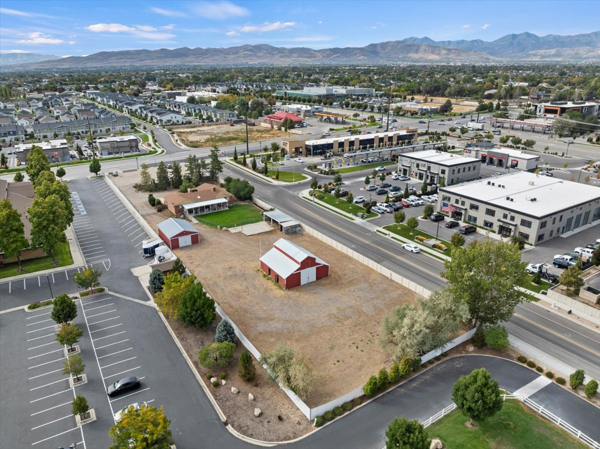 Infill Redevelopment Opportunity | South Jordan, Utah Acreage: 1.09 Acres Zoning: A-5 (City supportive of rezoning) Location: South Jordan | Salt Lake County Property Overview This 1.09-acre infill parcel represents a rare redevelopment opportunity in the heart of South Jordan, one of Salt Lake County's most desirable and growth-oriented submarkets. The City of South Jordan has expressed openness to rezoning, allowing for a wide range of future development scenarios including mixed-use, residential, commercial, or office. **Shown by Appointment only and proof of funds/funding.  The site currently includes a 3,300 square foot single-family residence, along with a barn and workshop, offering interim income or owner-use while entitlements are pursued. For developers and investors, the existing improvements support a land-banking strategy with near-term usability and long-term upside. Development Highlights City receptive to rezoning discussions Suitable for mixed-use, residential density, office, or neighborhood commercial 1.09 acres of infill land in an established growth corridor Utilities available nearby (buyer to verify) Flat, usable site with redevelopment potential South Jordan continues to attract investment due to its strong demographics, access to major transportation corridors, and sustained residential and commercial demand. The property's infill location positions it well for future entitlement-driven value creation. Property is being marketed based on future potential, not existing residential use Buyer to verify zoning changes, density, and development feasibility Conceptual discussions with the city encouraged        Access to this Property is actually on Beckstead Lane, with 2 access points. 1.09 acres Waiting to be Developed. TOP Height 30feet, Property currently has a 3300 sqft Rambler style home plus a Barn w/Stalls, Loft & tack room.  2nd outbuilding is a Machine shop.  ***Do Not Disturb Owners without Appointment...*** Do NOT enter property without Appointment.***  Shown by Appointment Only and Must provide Lender Approval Letter for showings.*** the City of South Jordan owns the small parcel on 11400 South/currently used as parking for local business. could possibly be purchased also. Questions can be directed to South Jordan City.** Great opportunity to be near everything & right off Redwood Rd.