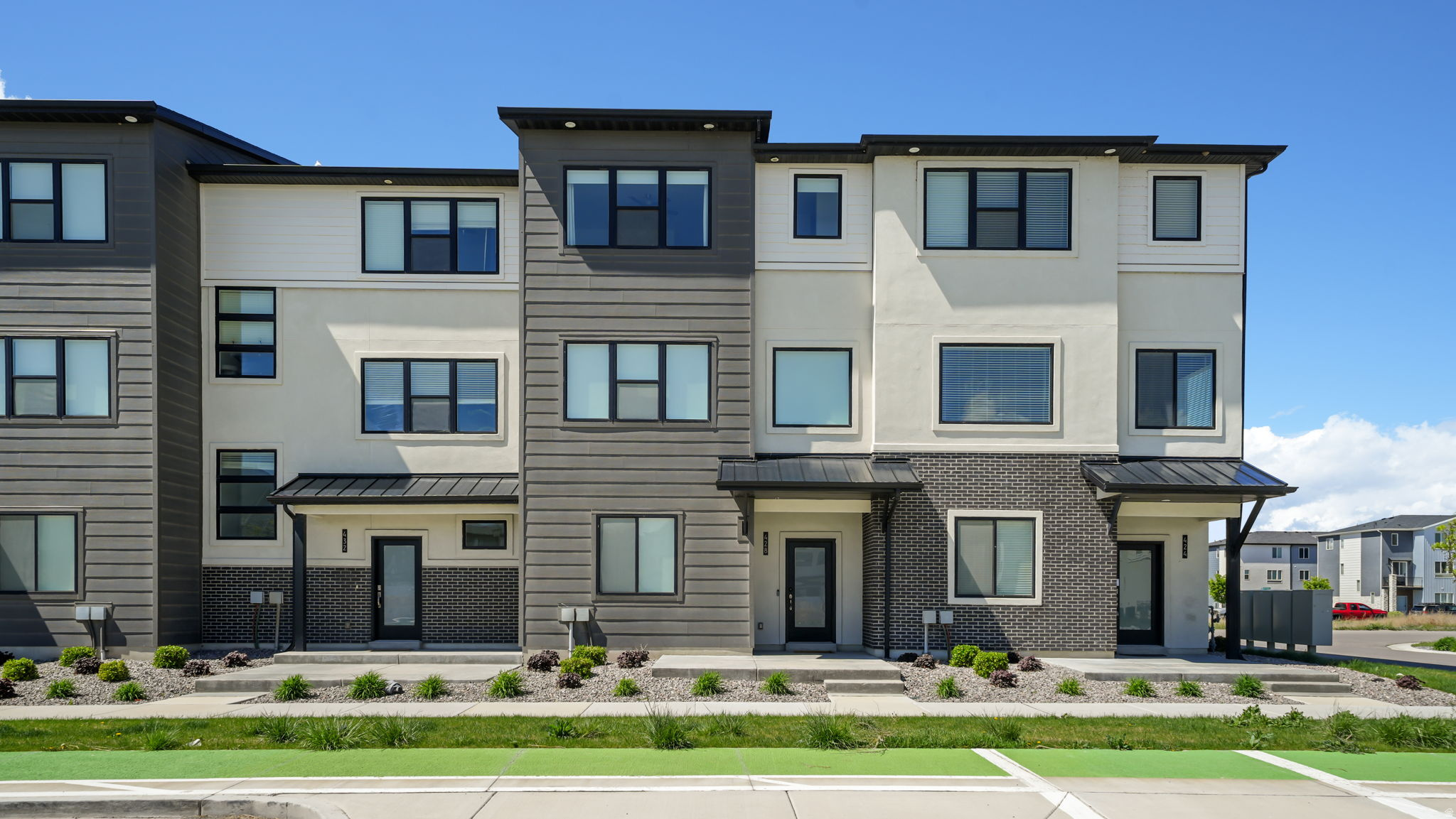 Experience the perfect synthesis of modern architecture and effortless living in this pristine townhome situated in the premier Lakeshore Landing community. As a desirable unit built in 2022, this residence enjoys an abundance of natural light and an enhanced sense of privacy across three thoughtfully designed stories totaling 1,994 square feet. The expansive layout features four well-proportioned bedrooms and three bathrooms, including a versatile second-floor family room and a refined primary suite complete with a generous walk-in closet. Residents enjoy a maintenance-free lifestyle with snow removal, exterior insurance, and grounds maintenance all professionally managed through the HOA. The lifestyle at Lakeshore Landing is defined by its resort-style amenities, offering exclusive access to a state-of-the-art clubhouse, outdoor pool, and dedicated courts for pickleball and basketball. The community is further enriched by playgrounds, picnic areas, and scenic biking trails, creating an inviting environment for relaxation and recreation. Ideally positioned for the modern professional, the property offers walking-distance access to the American Fork FrontRunner station and immediate entry to I-15 and Pioneer Crossing, ensuring a seamless commute to Lehi, Provo, or Salt Lake City. Beyond the community gates, you are just blocks away from major retail hubs like Target and Walmart, placing every urban essential within reach. This property stands as a sophisticated gateway to the best of Utah County's convenience and recreation.