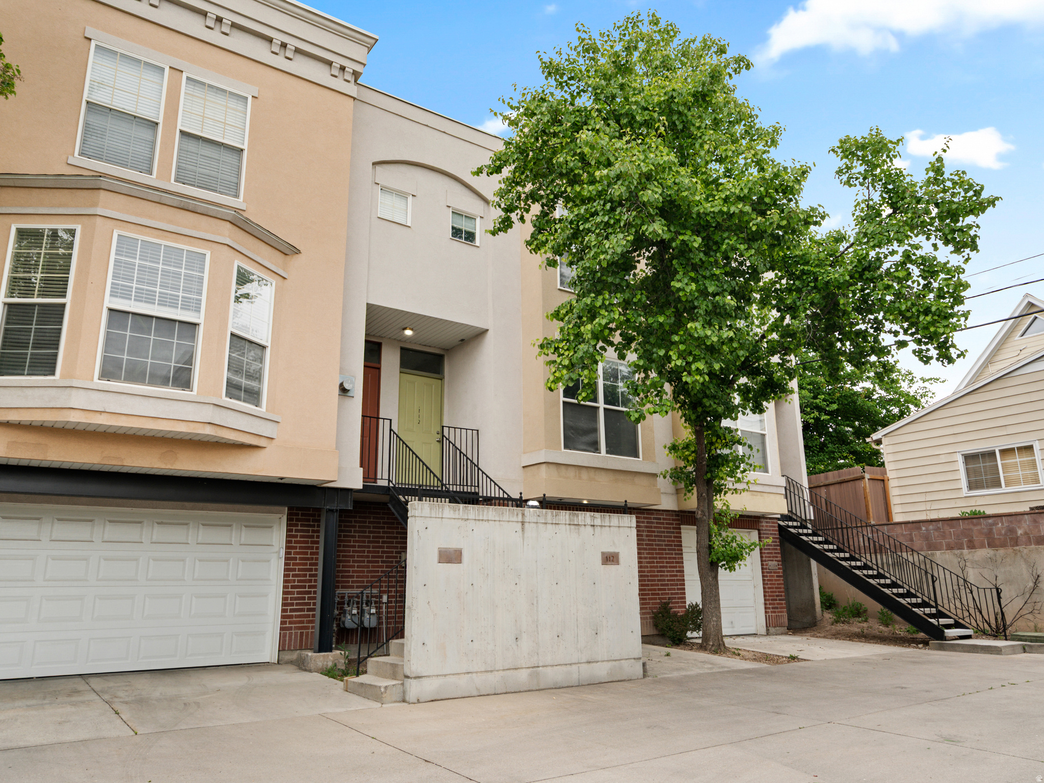 Experience low-maintenance city living without compromising on space or serenity. Situated in a quiet, secluded position at the rear of the community, this pristine townhome delivers a sophisticated and comfortable environment perfectly tailored for today's hybrid lifestyle. The expansive layout is anchored by a generous suite, boasting a walk-in closet and an oversized workspace alcove, ideal for a high-efficiency home office with Google Fiber connectivity. Seamlessly connected to downtown and the TRAX network, the property includes an oversized garage with exceptional storage capacity and arrives fully equipped with all appliances. Meticulously maintained and entirely move-in ready.