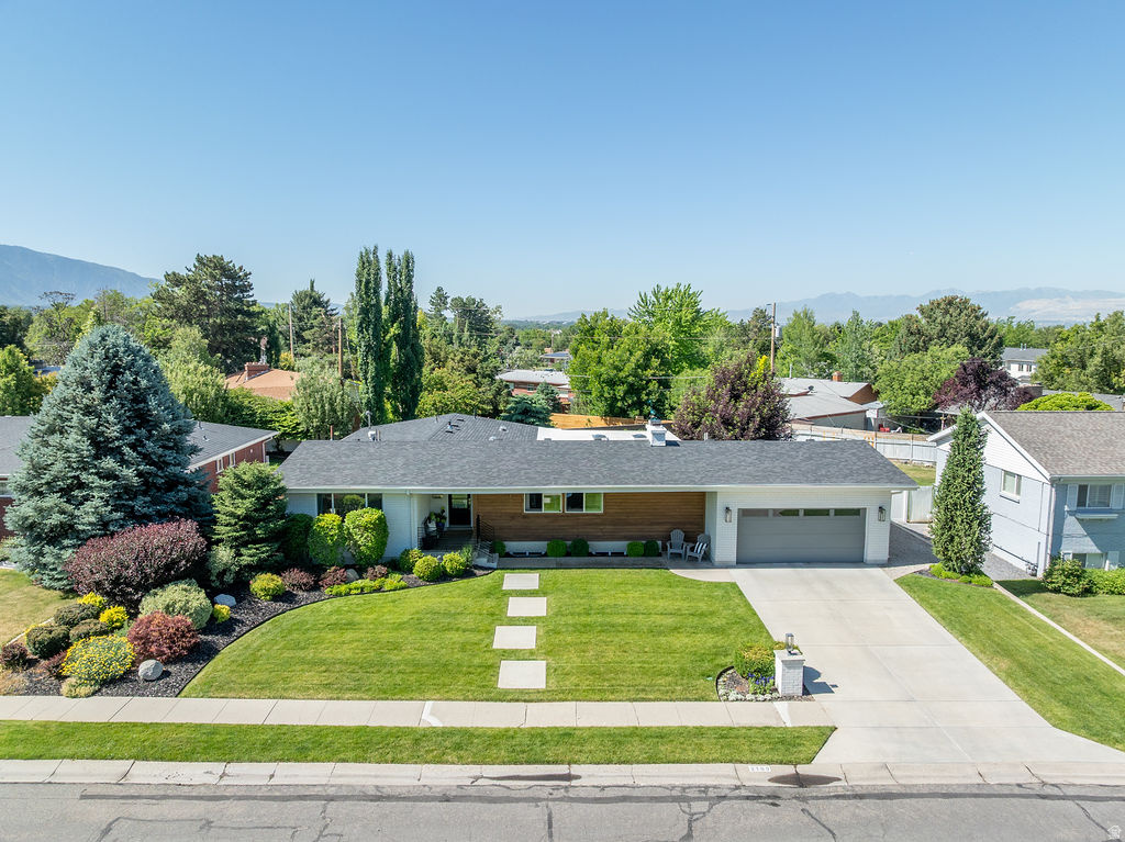Completely remodeled and meticulously maintained, this exceptional Holladay rambler offers nearly 3,900 square feet of thoughtfully designed living space on a beautifully landscaped quarter-acre lot. The open floor plan is filled with natural light and features a stunning updated kitchen, spacious gathering areas, hardwood flooring, remodeled baths, and a luxurious primary suite. The professionally finished basement provides additional family and entertaining space, while the private backyard serves as a true retreat with mature landscaping, firepit area, expansive lawn, and multiple outdoor living spaces. Rarely do homes come to market with this level of care, quality, and pride of ownership. Located on a quiet Holladay street near top-rated schools, parks, shopping, dining, and world-class mountain recreation.  Furnishings are negotiable, the sellers are willing to sell much of the furnishings if buyer would like.  Reach out to schedule your private showings before this one is gone!