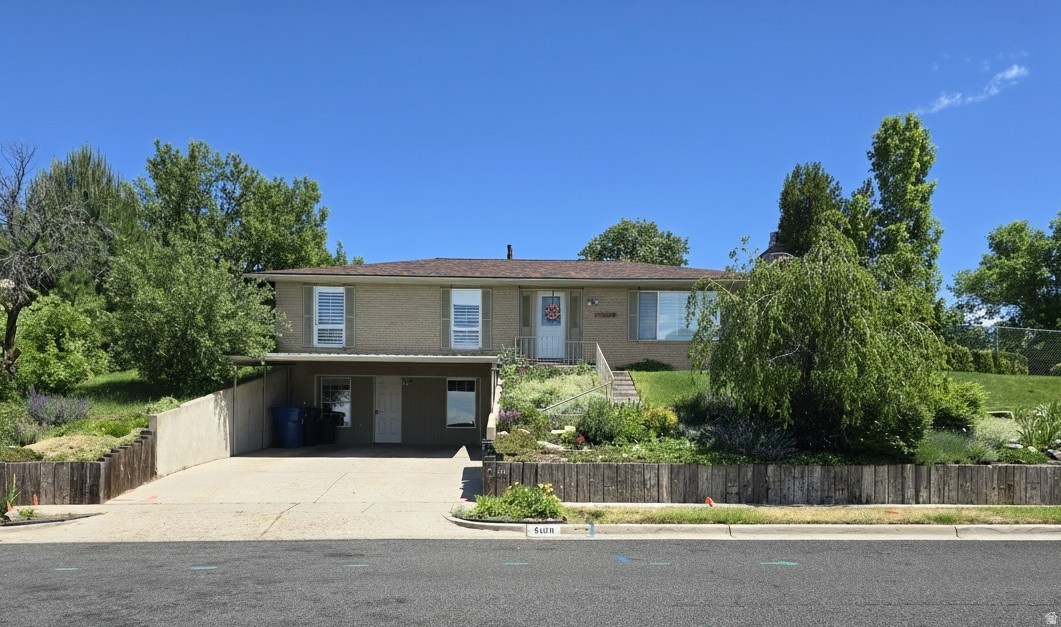 PRICE IMPROVEMENT! Looking for 6 bedrooms? I have the home for you. This 0.24 acre property has much to offer including 3 bathrooms, spacious updated kitchen, 2 fireplaces and a large family room area in the lower level. Private fenced backyard with no close backyard neighbors. Covered patio off the dining area for those summertime gatherings. Storage shed included. Seller insists the existing apple tree in the backyard produces the most delicious apples ever! Beautiful views of the valley from the front windows. Kitchen fully updated in 2022. New flooring in 2025. Water heater 3 years old. Roof 5 years old. A/C & heater 7 years old. This delightful home is situated in a well established neighborhood near the Ogden Regional Medical Center and close to highway 89 for great commuter access. Minutes from all the shopping centers that Riverdale has to offer. The property owner converted the 672 square foot attached garage into living space for additional bedrooms which a buyer could convert back to a garage. The original walkout entrance to the backyard was blocked off when garage was converted which could also be converted back to a basement entrance. Square footage is taken from the tax record and does not include the 2 bedrooms and hallway in the converted garage.