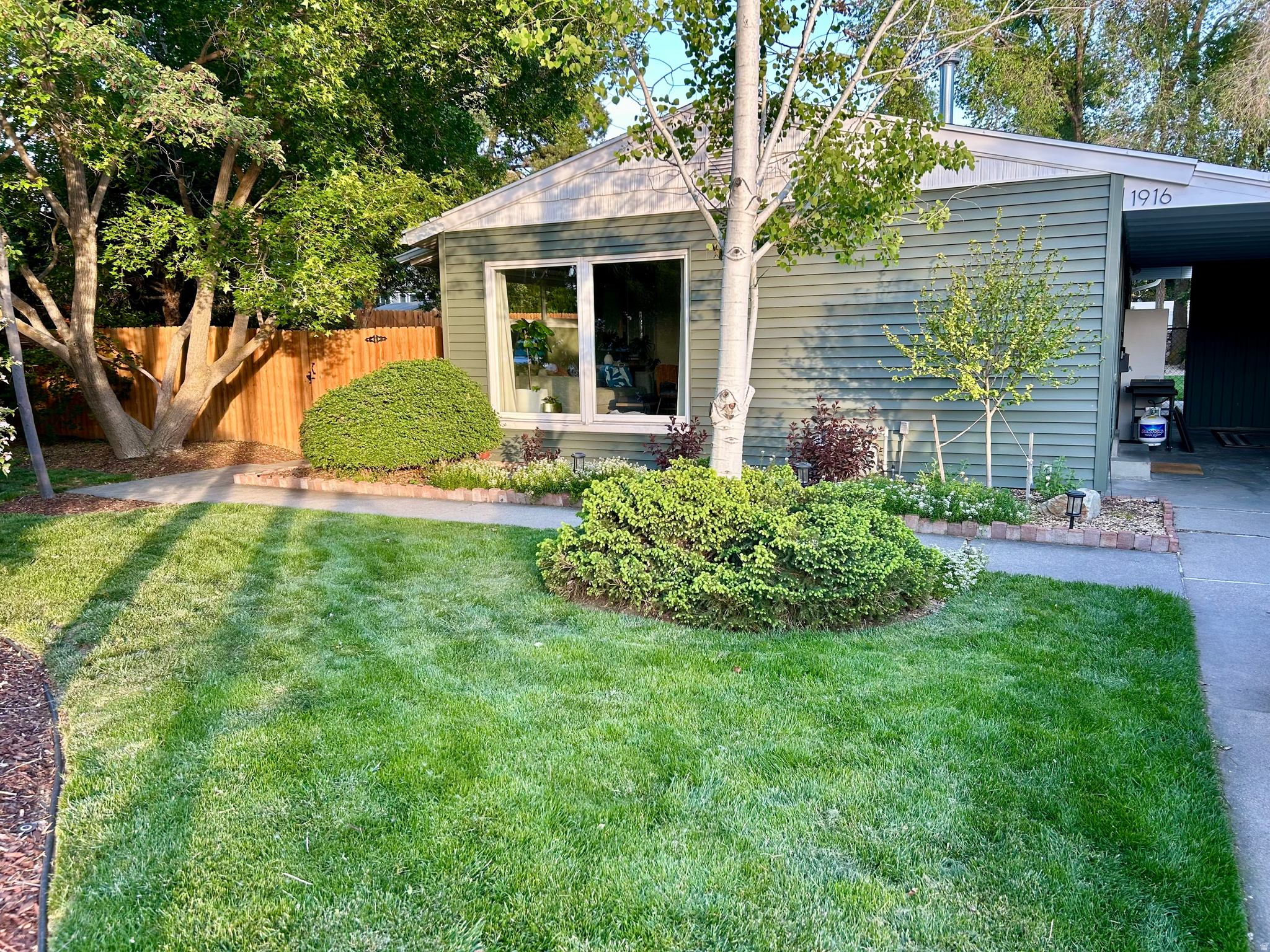 Nestled in one of Cottonwood Height's most desirable East-side neighborhoods, this beautifully updated mid-century bungalow blends timeless character with thoughtful modern upgrades. This inviting 3-bedroom home offers easy single living with a bright, functional layout filled with natural light from oversized picture windows.   Recent improvements include new siding, new furnace and A/C, updated windows, and a new sewer line. Offering both peace of mind and enhanced curb appeal. Inside, you'll find original hardwood flooring, a fully remodeled bathroom, quartzite kitchen countertops, and a stylish mid-century modern lighting that compliments the home's classic design.  Situated on a generous fully landscaped lot with Mature trees and gardens.  The property has an ADU that features a versatile detached heated and cooled flex space- ideal as a private office, creative studio, guest retreat, or a private gym.  This outdoor office/storage space adds even more Flexibility and functionality.   Enjoy an unbeatable location just minutes from world-skiing in Big and Little Cottonwood Canyons, with quick freeway access, shopping, dining, parks, and highly regarded schools within the Canyons School District.   Whether you're enjoying peaceful evenings in the private backyard or heading yo the canyon for a day on the slopes, this home offers the perfect blend of comfort, character, and convince.