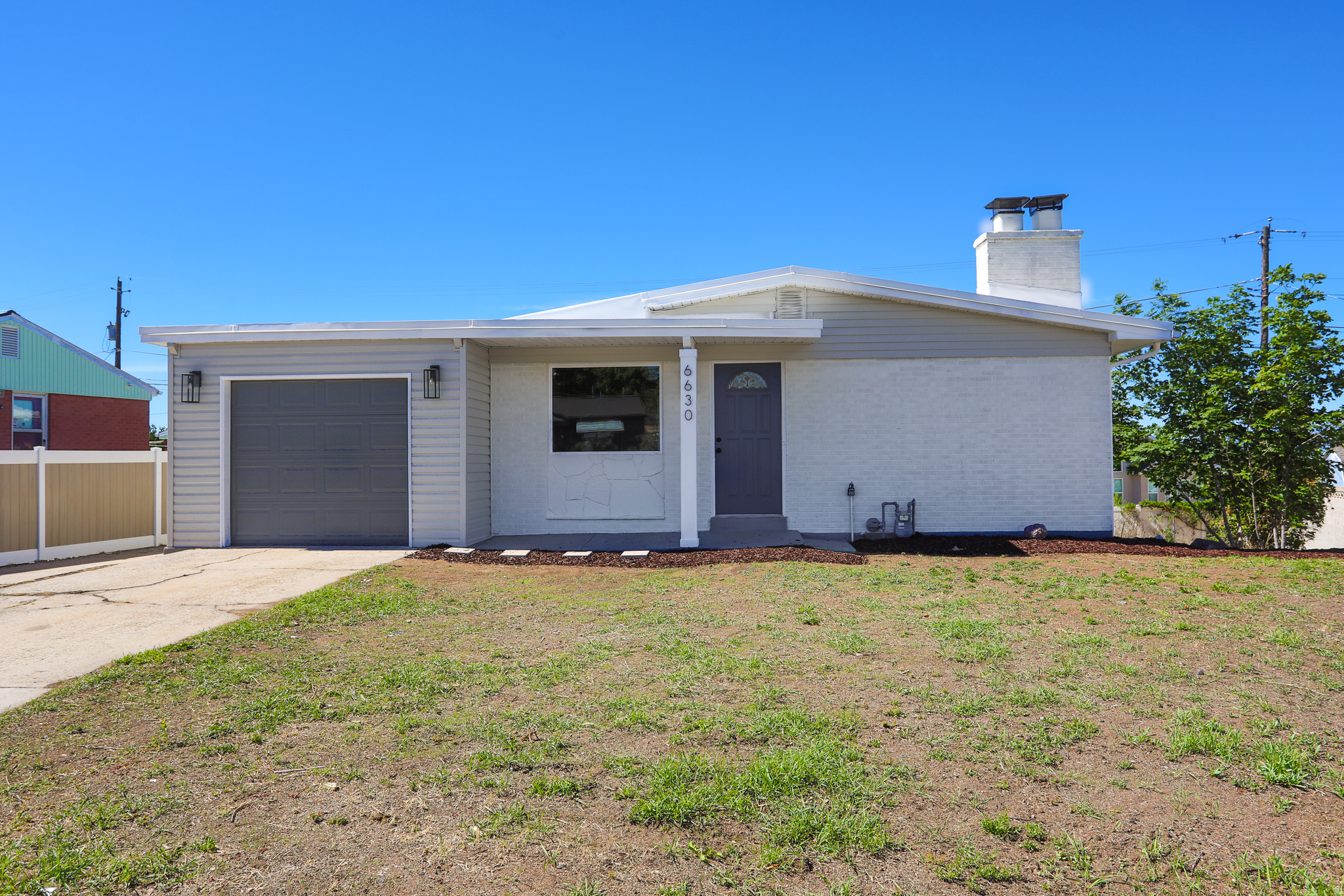 Beautifully updated West Valley home loaded with stunning modern upgrades! This move-in-ready gem features a fully separate basement entrance with its own kitchen, creating a perfect mother-in-law apartment or income-producing suite.From top to bottom, this home shines with high-end updates including:   Fresh new exterior paint   Brand-new garage door, windows, and roof   New furnace and central air conditioning   New carpet and luxury vinyl plank (LVP) flooring throughout   Gorgeous remodeled kitchens with quartz countertops, custom tiled backsplashes, and new stainless steel appliances   Remodeled bathrooms with new fixtures   New lighting and plumbing fixtures throughout Additional highlights include generous RV parking and a super-clean, turn-key condition. You truly won't want to miss this one-schedule your showing today!
