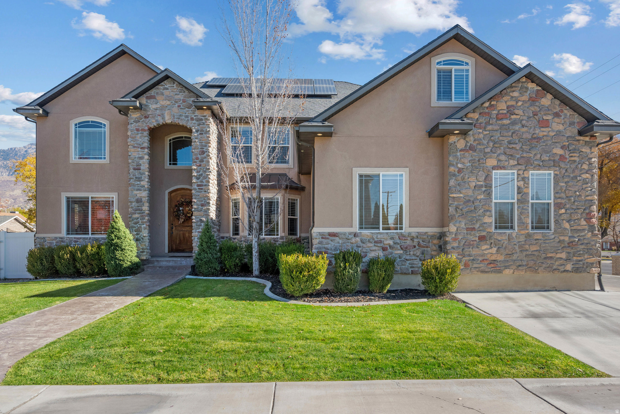 Welcome to this stunning home in the desirable Riverbottoms area of Provo. The open floor plan features vaulted ceilings, hardwood and travertine floors, and a bright kitchen with granite countertops, double ovens, a gas range, and French doors that open to a spacious patio and beautifully landscaped yard. The primary suite includes a luxurious bathroom with a separate tub and shower, a walk-in closet, and a bonus room that's perfect for a home office or quiet retreat. The fully finished basement includes a private mother-in-law apartment with its own entrance, full kitchen, and laundry. The apartment is currently rented for $1,600 per month with a lease through June 2026, providing excellent income potential or flexible living space for family. Large basement storage room! This home also features paid-off solar panels, offering energy efficiency and lower utility costs. With a three-car garage, mature trees, and a location close to schools, shopping, and outdoor recreation, this home offers comfort, convenience, and opportunity in one of Provo's most sought-after neighborhoods. Square feet as per County. Buyer and Buyer's Broker to verify all information including square footage and acreage.
