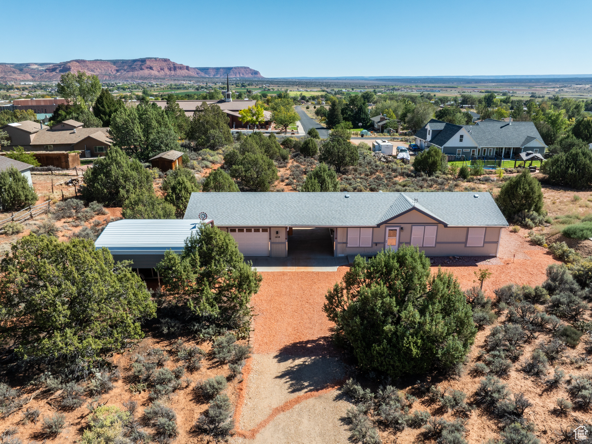 This cute turn-key 2017 manufactured home with 3 beds/2 baths and 950 sf has been lightly used as a second home for many years.  It is an open concept kitchen, dining, and living room, and has ceiling fans in all of the bedrooms and living room.  There are big closets inside the home and the 2.5-car garage also has lots of room.  The yard has lots of mature cedar trees, sage, and cactus for natural look and easy care with decorative colored stone all around the home and the home sits back on the lot.  Deer are known to wander through the 3/4-acre property and the dark, night skies are beautiful.  There are big views of the red rock cliffs west and 17 miles of valley to the next ridge east.  There is a two-car garage wired with 220 volt power and a 2-car pole barn with 10' of clearance.  City water in the septic, electric forced air heat and central air conditioning.  This home would be wonderful for first-time homebuyer(s) and would work well as an investment.  Kanab is 75 miles to Zion National Park, 75 miles to Bryce Canyon National Park, and 75 miles to the North Rim of the Grand Canyon.  Tax records shown are taxed at the higher tax rate for a second home.  Exterior is fire resistant, cement board panel.