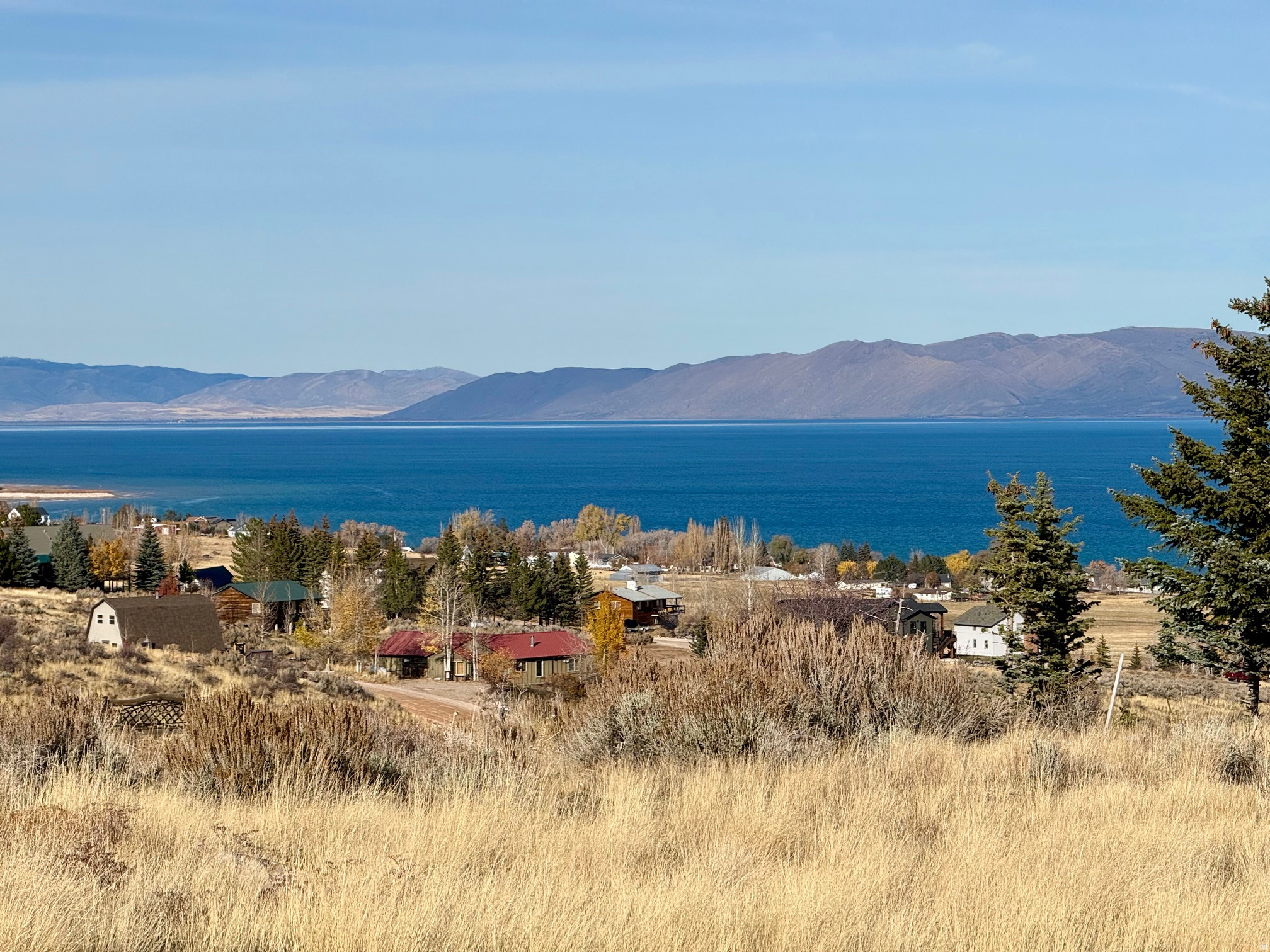 Building lot in beautiful Bear Lake!! This lot has a nice gently slope with views of the Bear Lake Golf Course, lake and mountains!  Short-term rentals not restricted!  For more info on rentals please contact the HOA or visit their website.  Close to golf course, a short drive to lake access, close to Garden City shops and restaurants.  Direct access from this subdivision to miles of trails for ATV/snowmobiling.  Year round accessible.