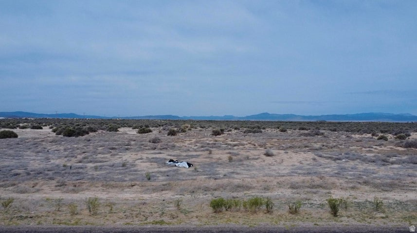 Rare opportunity to own 18.5 acres in Beryl, Utah with 0.5 acre-feet of valuable water rights included #71-4912 (1945). Right off of Beryl Highway with paved road access. Possible commercial applications. Perfect for building a home, cabin, barndominium, ranch property, mini farm, off-grid retreat, or recreational getaway. Plenty of space for livestock, horses, RVs, toys, gardens, orchards, or future development potential. Enjoy wide open spaces, privacy, dark night skies, and breathtaking desert and mountain views. Beryl is known for its peaceful rural lifestyle, outdoor recreation, ATV riding, hunting, camping, and easy access to Enterprise, Cedar City, and St. George. Water rights add tremendous long-term value in Southern Utah. Great investment, getaway, or future homestead opportunity
