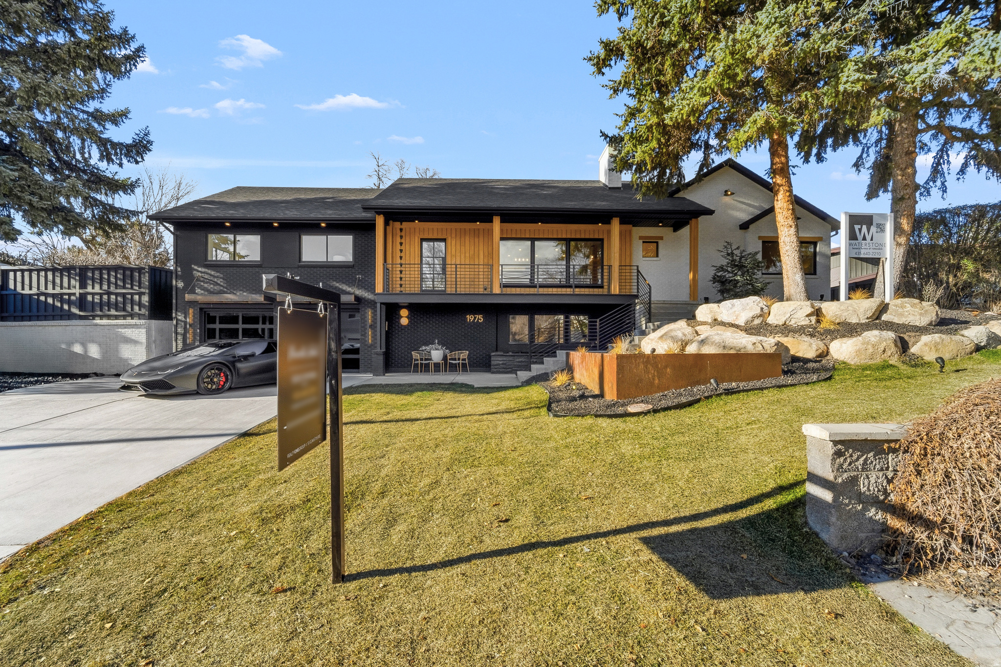 *** SELLER WILL PAY FOR 2/1 BUY DOWN WITH ACCEPTABLE OFFER *** 2% INTEREST DROP IN YEAR ONE AND 1% DROP IN YEAR 2.  ---   PLEASE ALLOW 4 HRS NOTICE FOR SHOWINGS.    ---   Sometimes a remodel just seems to come together so well that you would think it was the original design.  Such as the case of this beautiful remodel in the heart of Holladay.  Upon entry you'll immediately feel something different, something unique, a beautiful blend of the present with homage to the past with the exposed terra-cotta brick that was intentionally blended into the remodel design from the luxury remodeling team at Waterstone.  The expansive dining area is intentionally placed adjacent to the open kitchen.  The gourmet kitchen features a 6 burner cooktop with minimalistic designed that is then complimented with a butler's pantry offering another sink and refrigerator and leads out to the outdoor cooking area complete with gas hookup for a future grilling station.  From the main living area, guests are treated with an assortment of beautiful spaces that are within the line of sight that lures you in from room to room.  Upon venturing into the next rooms, which are the family room and guest suite area, you can't help but notice the well planned guest suite and bath, the artistic chandelier hanging above the wood staircase, the restaurant style wine room and the private office.  But, once again, from this room, you are teased with the senses of the next space by a wall of folding glass which allows the indoor to flow seamlessly to the outdoor where a gas fire pit awaits with built in seating.  From here you can also see the inviting covered gazebo with 2 chandeliers swinging in the breeze to the right and a professionally installed putting green to the left.  Around the corner is a large tree positioned perfectly amid the spacious grass area.  Stepping down the family room staircase, you are greeted with a custom wood wall slat paneled movie area that invites you into the home gym with floor to ceiling mirrors, an adjacent safe room and designer half bath.  Venturing back upstairs and to the left of the main entrance, you see the full bath in the hall that serves the 2 bedrooms in front of the home.  A second staircase leads downstairs where access to the garage is lined with a slatted bench in the mudroom.  Another guest suite on this level and on this side of the basement features a spacious walk-in closet and grand bathroom making it ideal for family or guests wishing to reside on the garage level living.   Saving the best for last, the crown jewel of the home.  The double doors on the main floor begs to be opened to reveal something truly special.  This is where the original home was dramatically expanded to add one of the most luxurious primary suites on the market.  A five foot walkway that is reminiscent of a luxury suite in an upscale luxury hotel leads you to your primary suite.  To the left is a closet that leaves you breathless with room for a folding table or private massage table and hookups for a stackable washer and dryer setup.  The dramatic vaults separates the primary suite into two areas, the bed to the left and a large siting area to the right that is highlighted by a gas fireplace.  Two doors, one on each side of the fireplace lead to the back yard oasis.  The open bathroom is divided by walnut wood slats that gives the open yet private separation of space.  A massive counter top / vanity spans the entire back wall.  To the left is one of the most unique water rooms complete with 2 skylights, once again, bringing the outdoor in.  A private water closet and hotel style coffee bar area completes this luxury ensuite.