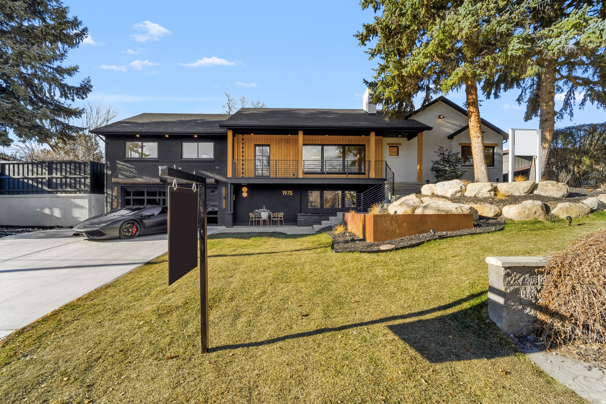 PRICE REDUCTION - ALLOW 4 HRS NOTICE FOR SHOWINGS.    ---   Sometimes a remodel just seems to come together so well that you would think it was the original design.  Such as the case of this beautiful remodel in the heart of Holladay.  Upon entry you'll immediately feel something different, something unique, a beautiful blend of the present with homage to the past with the exposed terra-cotta brick that was intentionally blended into the remodel design from the luxury remodeling team at Waterstone.  The expansive dining area is intentionally placed adjacent to the open kitchen.  The gourmet kitchen features a 6 burner cooktop with minimalistic designed that is then complimented with a butler's pantry offering another sink and refrigerator and leads out to the outdoor cooking area complete with gas hookup for a future grilling station.  From the main living area, guests are treated with an assortment of beautiful spaces that are within the line of sight that lures you in from room to room.  Upon venturing into the next rooms, which are the family room and guest suite area, you can't help but notice the well planned guest suite and bath, the artistic chandelier hanging above the wood staircase, the restaurant style wine room and the private office.  But, once again, from this room, you are teased with the senses of the next space by a wall of folding glass which allows the indoor to flow seamlessly to the outdoor where a gas fire pit awaits with built in seating.  From here you can also see the inviting covered gazebo with 2 chandeliers swinging in the breeze to the right and a professionally installed putting green to the left.  Around the corner is a large tree positioned perfectly amid the spacious grass area.  Stepping down the family room staircase, you are greeted with a custom wood wall slat paneled movie area that invites you into the home gym with floor to ceiling mirrors, an adjacent safe room and designer half bath.  Venturing back upstairs and to the left of the main entrance, you see the full bath in the hall that serves the 2 bedrooms in front of the home.  A second staircase leads downstairs where access to the garage is lined with a slatted bench in the mudroom.  Another guest suite on this level and on this side of the basement features a spacious walk-in closet and grand bathroom making it ideal for family or guests wishing to reside on the garage level living.   Saving the best for last, the crown jewel of the home.  The double doors on the main floor begs to be opened to reveal something truly special.  This is where the original home was dramatically expanded to add one of the most luxurious primary suites on the market.  A five foot walkway that is reminiscent of a luxury suite in an upscale luxury hotel leads you to your primary suite.  To the left is a closet that leaves you breathless with room for a folding table or private massage table and hookups for a stackable washer and dryer setup.  The dramatic vaults separates the primary suite into two areas, the bed to the left and a large siting area to the right that is highlighted by a gas fireplace.  Two doors, one on each side of the fireplace lead to the back yard oasis.  The open bathroom is divided by walnut wood slats that gives the open yet private separation of space.  A massive counter top / vanity spans the entire back wall.  To the left is one of the most unique water rooms complete with 2 skylights, once again, bringing the outdoor in.  A private water closet and hotel style coffee bar area completes this luxury ensuite.